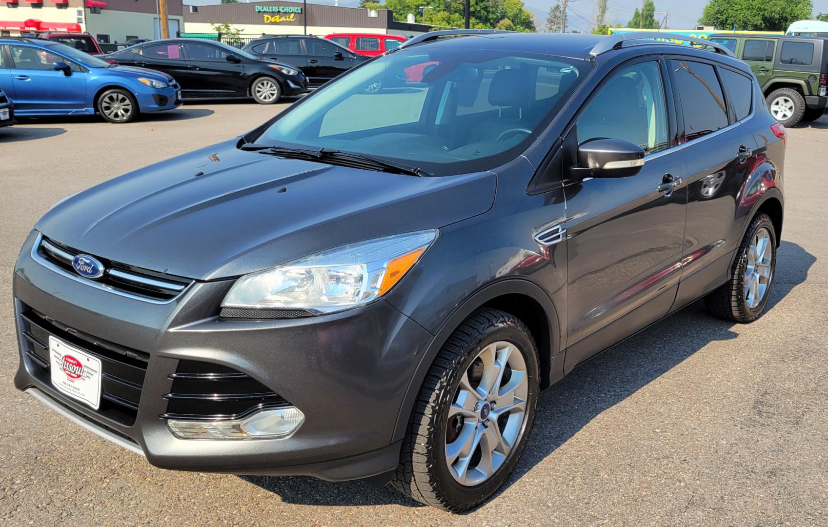 2016 Grey /Black Ford Escape Titanium 4WD (1FMCU9J91GU) with an 2.0L L4 engine, 6 Speed Auto transmission, located at 450 N Russell, Missoula, MT, 59801, (406) 543-6600, 46.874496, -114.017433 - Nice Little 4WD SUV. 2.0L L4 Engine. 6 Speed Automatic Transmission. Heated Seats. Power Lift Gate. Bluetooth. Backup Camera. Touch Screen. AM FM CD. Power Drivers Seat. Fog Lights. Roof Rack Rails. Remote Start. Weather Tech Floor Liners. - Photo#3