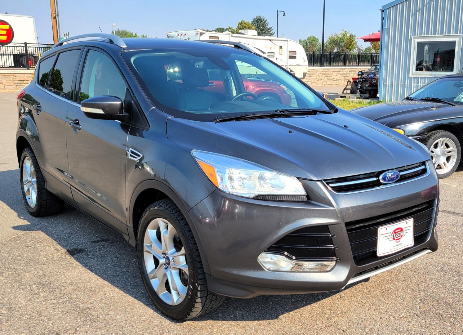 2016 Grey /Black Ford Escape Titanium 4WD (1FMCU9J91GU) with an 2.0L L4 engine, 6 Speed Auto transmission, located at 450 N Russell, Missoula, MT, 59801, (406) 543-6600, 46.874496, -114.017433 - Nice Little 4WD SUV. 2.0L L4 Engine. 6 Speed Automatic Transmission. Heated Seats. Power Lift Gate. Bluetooth. Backup Camera. Touch Screen. AM FM CD. Power Drivers Seat. Fog Lights. Roof Rack Rails. Remote Start. Weather Tech Floor Liners. - Photo#0