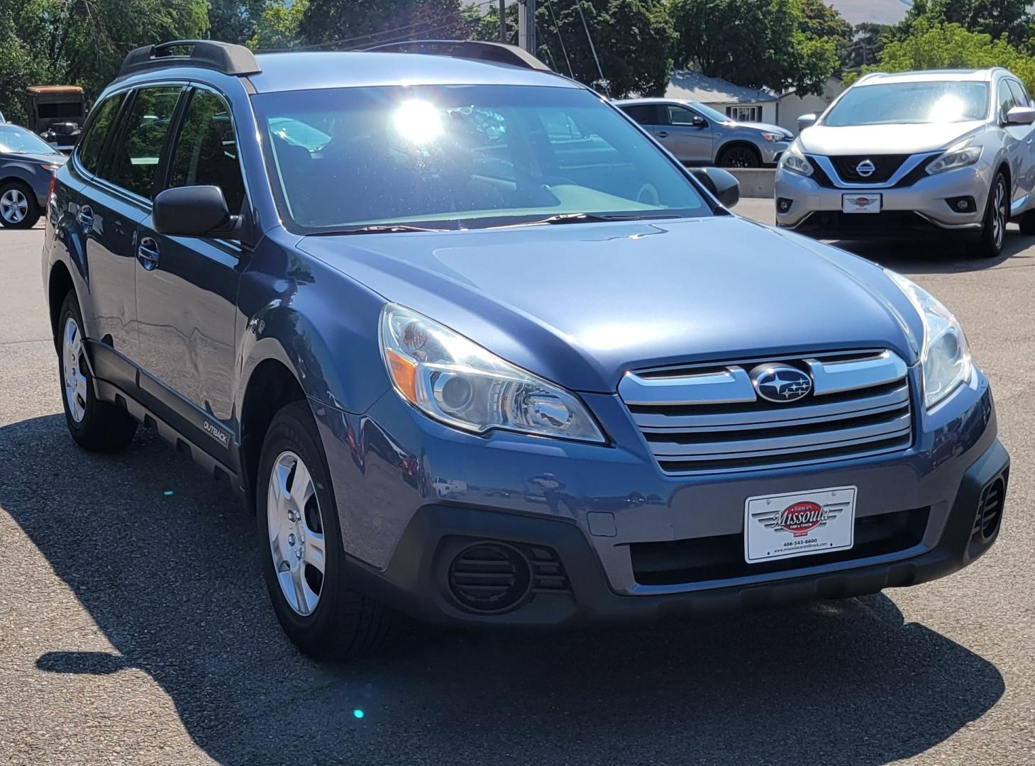 2013 Blue /Black Subaru Outback 2.5I (4S4BRBAC7D3) with an 2.5L H4 engine, Automatic transmission, located at 450 N Russell, Missoula, MT, 59801, (406) 543-6600, 46.874496, -114.017433 - One Owner. All Wheel Drive. 2.5L H4 Engine. Automatic Transmission. AM FM CD. Air. Cruise. Tilt. Power Windows and Locks. Bluetooth. Small dent in passenger front door. - Photo#2