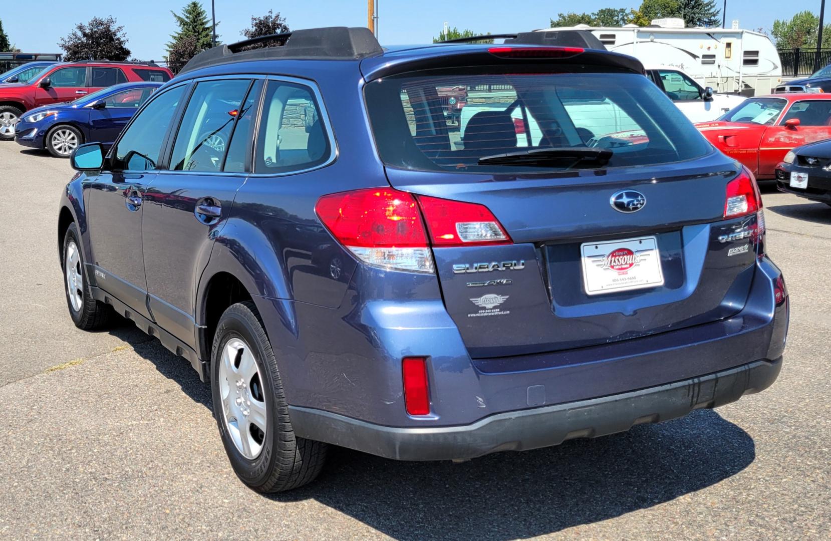 2013 Blue /Black Subaru Outback 2.5I (4S4BRBAC7D3) with an 2.5L H4 engine, Automatic transmission, located at 450 N Russell, Missoula, MT, 59801, (406) 543-6600, 46.874496, -114.017433 - One Owner. All Wheel Drive. 2.5L H4 Engine. Automatic Transmission. AM FM CD. Air. Cruise. Tilt. Power Windows and Locks. Bluetooth. Small dent in passenger front door. - Photo#4