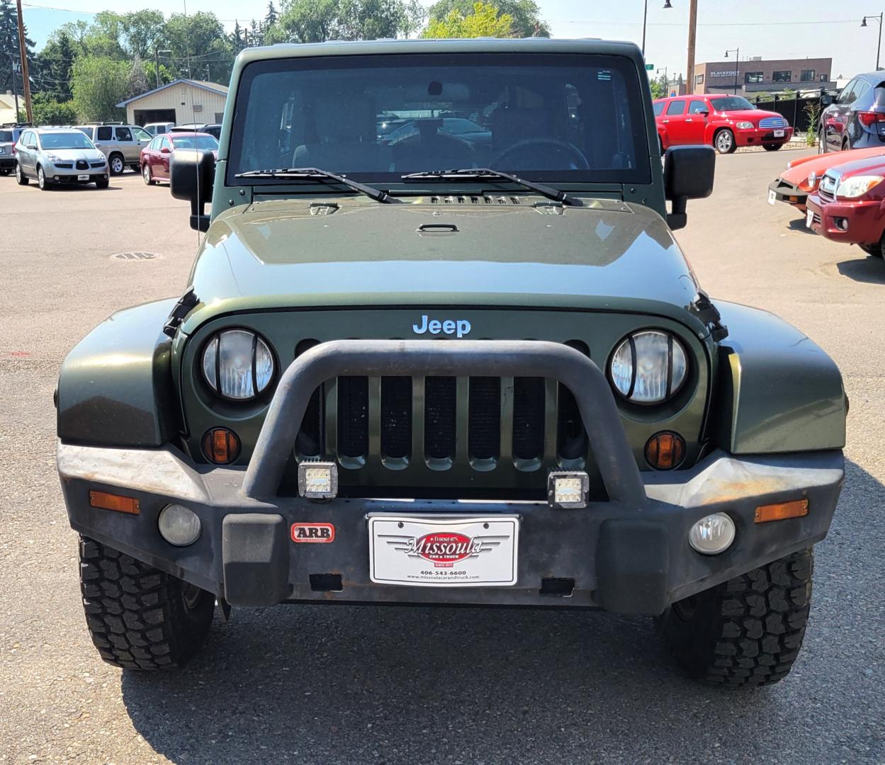 2007 Green /Black Jeep Wrangler Unlimited Sahara 4WD (1J4GA59137L) with an 3.8L V6 OHV 12V engine, Automatic transmission, located at 450 N Russell, Missoula, MT, 59801, (406) 543-6600, 46.874496, -114.017433 - 4WD. 4 Door Wrangler. Removable Hardtop. 3.8L V6 Engine. Automatic Transmission. Power Windows and Locks. Air. Cruise. Tilt. AM FM CD. New Tires. - Photo#2