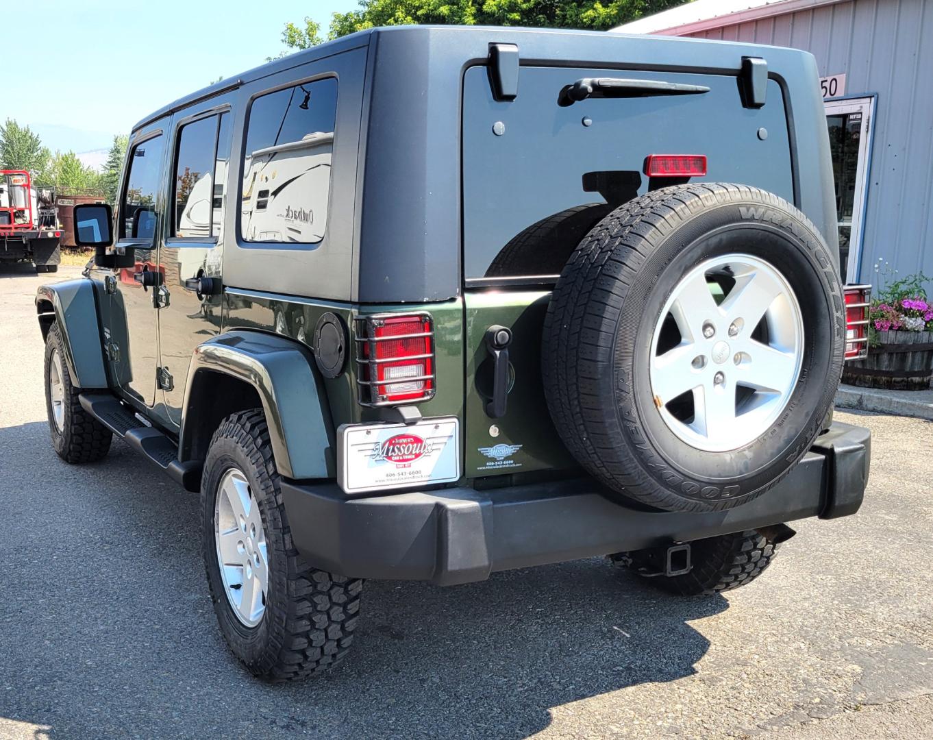 2007 Green /Black Jeep Wrangler Unlimited Sahara 4WD (1J4GA59137L) with an 3.8L V6 OHV 12V engine, Automatic transmission, located at 450 N Russell, Missoula, MT, 59801, (406) 543-6600, 46.874496, -114.017433 - 4WD. 4 Door Wrangler. Removable Hardtop. 3.8L V6 Engine. Automatic Transmission. Power Windows and Locks. Air. Cruise. Tilt. AM FM CD. New Tires. - Photo#7