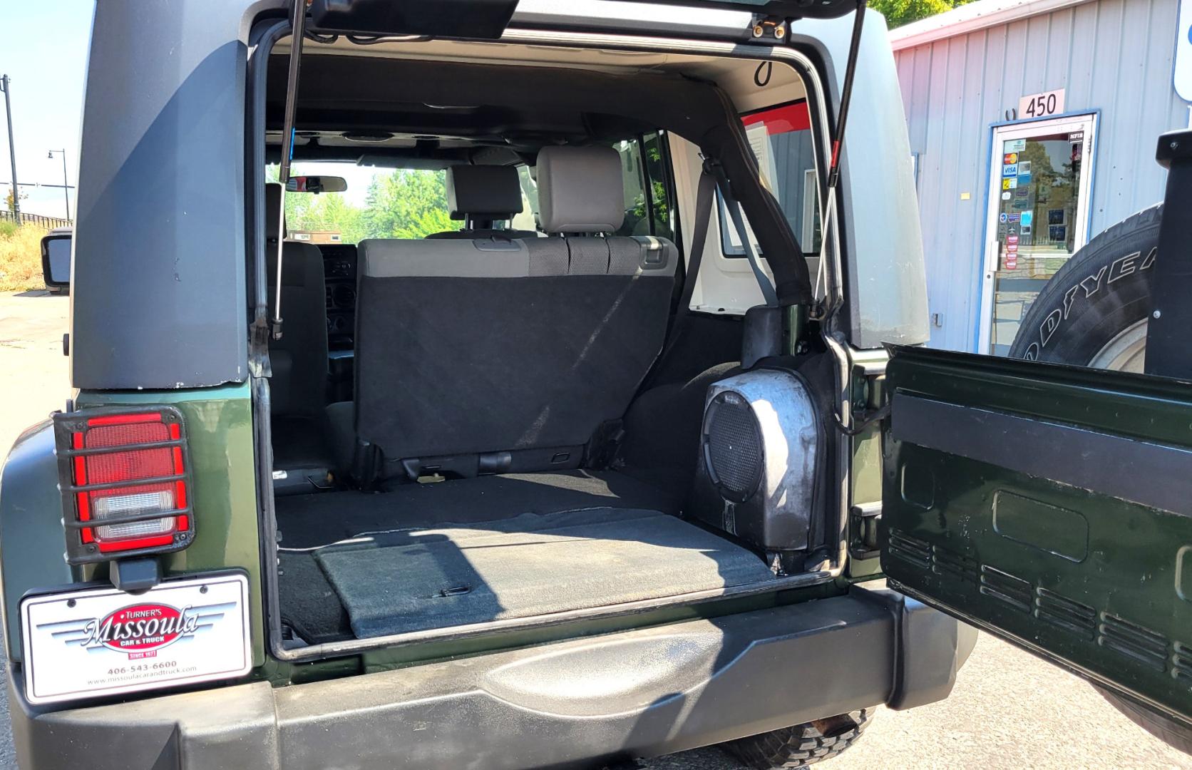 2007 Green /Black Jeep Wrangler Unlimited Sahara 4WD (1J4GA59137L) with an 3.8L V6 OHV 12V engine, Automatic transmission, located at 450 N Russell, Missoula, MT, 59801, (406) 543-6600, 46.874496, -114.017433 - 4WD. 4 Door Wrangler. Removable Hardtop. 3.8L V6 Engine. Automatic Transmission. Power Windows and Locks. Air. Cruise. Tilt. AM FM CD. New Tires. - Photo#8