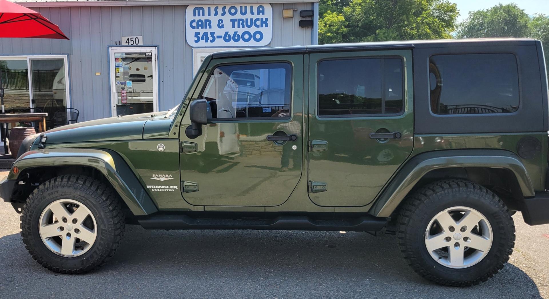 2007 Green /Black Jeep Wrangler Unlimited Sahara 4WD (1J4GA59137L) with an 3.8L V6 OHV 12V engine, Automatic transmission, located at 450 N Russell, Missoula, MT, 59801, (406) 543-6600, 46.874496, -114.017433 - 4WD. 4 Door Wrangler. Removable Hardtop. 3.8L V6 Engine. Automatic Transmission. Power Windows and Locks. Air. Cruise. Tilt. AM FM CD. New Tires. - Photo#0