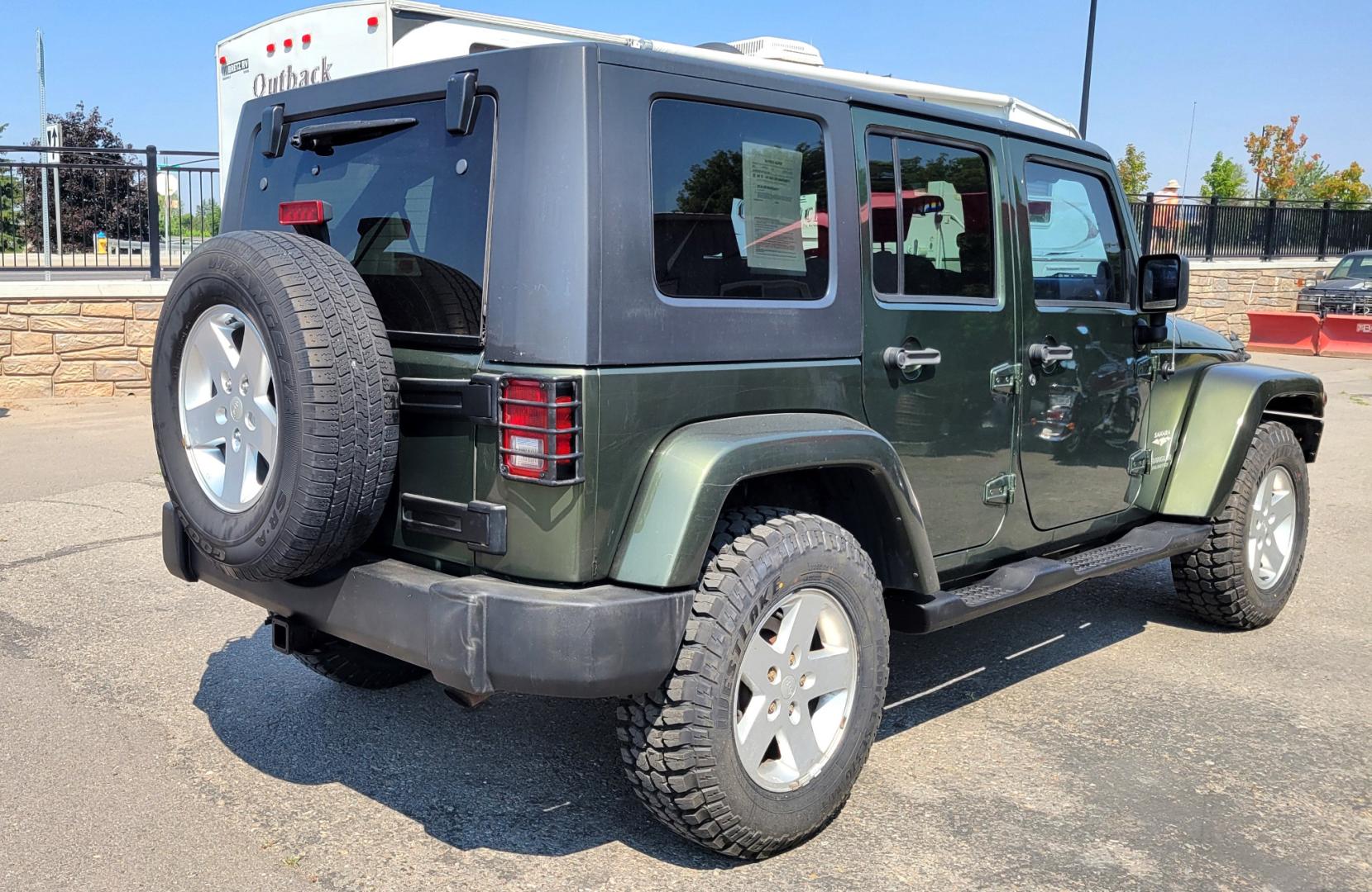 2007 Green /Black Jeep Wrangler Unlimited Sahara 4WD (1J4GA59137L) with an 3.8L V6 OHV 12V engine, Automatic transmission, located at 450 N Russell, Missoula, MT, 59801, (406) 543-6600, 46.874496, -114.017433 - 4WD. 4 Door Wrangler. Removable Hardtop. 3.8L V6 Engine. Automatic Transmission. Power Windows and Locks. Air. Cruise. Tilt. AM FM CD. New Tires. - Photo#5