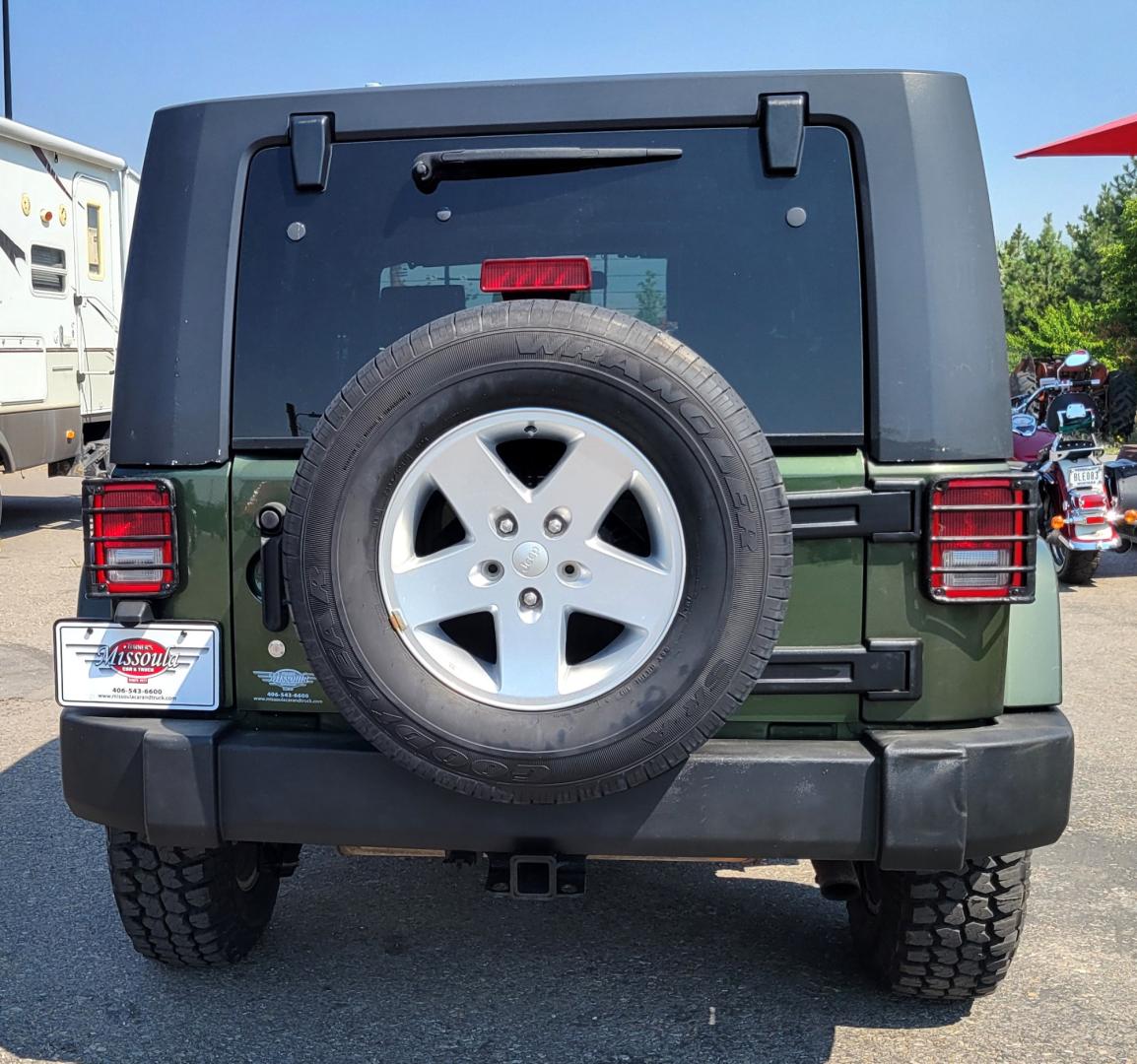 2007 Green /Black Jeep Wrangler Unlimited Sahara 4WD (1J4GA59137L) with an 3.8L V6 OHV 12V engine, Automatic transmission, located at 450 N Russell, Missoula, MT, 59801, (406) 543-6600, 46.874496, -114.017433 - 4WD. 4 Door Wrangler. Removable Hardtop. 3.8L V6 Engine. Automatic Transmission. Power Windows and Locks. Air. Cruise. Tilt. AM FM CD. New Tires. - Photo#6