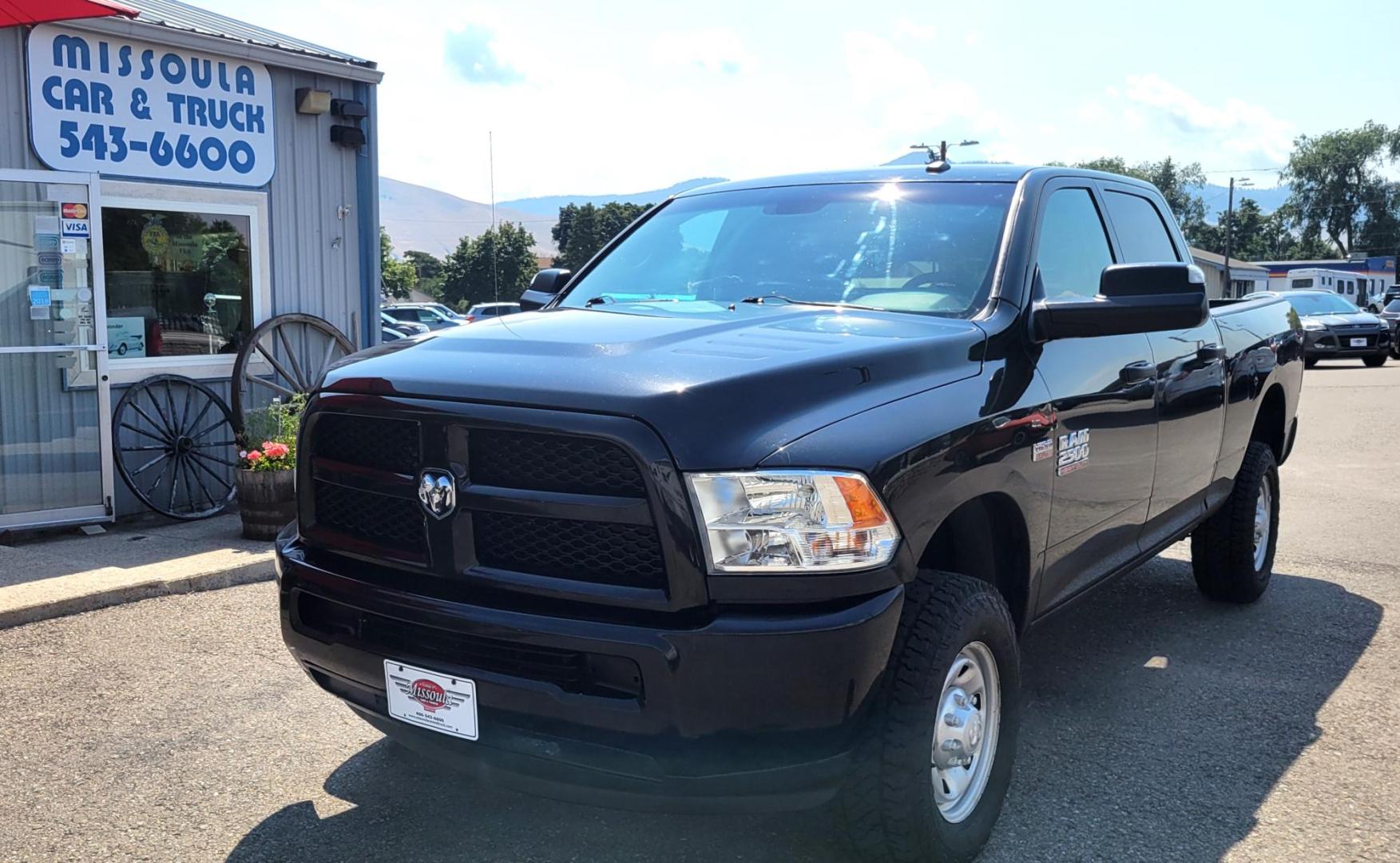 2015 Black /Black RAM 2500 Tradesman Crew Cab SWB 4WD (3C6UR5CJ3FG) with an 6.7L L6 engine, 6-Speed Automatic transmission, located at 450 N Russell, Missoula, MT, 59801, (406) 543-6600, 46.874496, -114.017433 - Nice Heavy Duty 3/4 Ton 4WD. 6.4L Hemi Engine. 6 Speed Auto Transmission. Air. Cruise. Tilt. Power Windows and Locks. AM FM XM Bluetooth. Like NEW Tires. - Photo#1