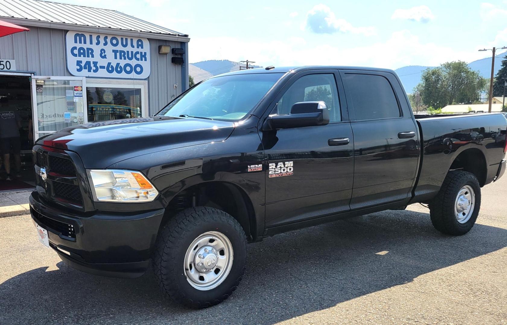 2015 Black /Black RAM 2500 Tradesman Crew Cab SWB 4WD (3C6UR5CJ3FG) with an 6.7L L6 engine, 6-Speed Automatic transmission, located at 450 N Russell, Missoula, MT, 59801, (406) 543-6600, 46.874496, -114.017433 - Nice Heavy Duty 3/4 Ton 4WD. 6.4L Hemi Engine. 6 Speed Auto Transmission. Air. Cruise. Tilt. Power Windows and Locks. AM FM XM Bluetooth. Like NEW Tires. - Photo#0