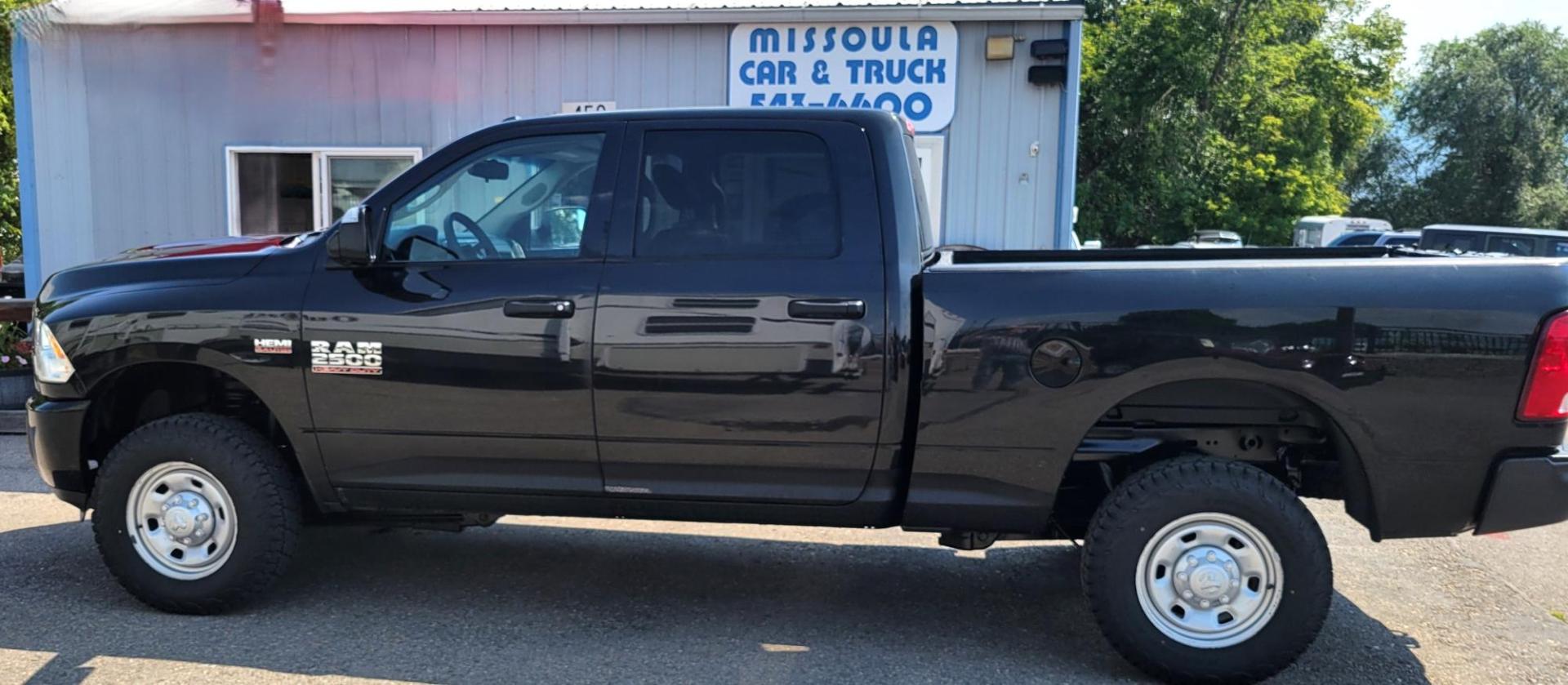 2015 Black /Black RAM 2500 Tradesman Crew Cab SWB 4WD (3C6UR5CJ3FG) with an 6.7L L6 engine, 6-Speed Automatic transmission, located at 450 N Russell, Missoula, MT, 59801, (406) 543-6600, 46.874496, -114.017433 - Nice Heavy Duty 3/4 Ton 4WD. 6.4L Hemi Engine. 6 Speed Auto Transmission. Air. Cruise. Tilt. Power Windows and Locks. AM FM XM Bluetooth. Like NEW Tires. - Photo#7