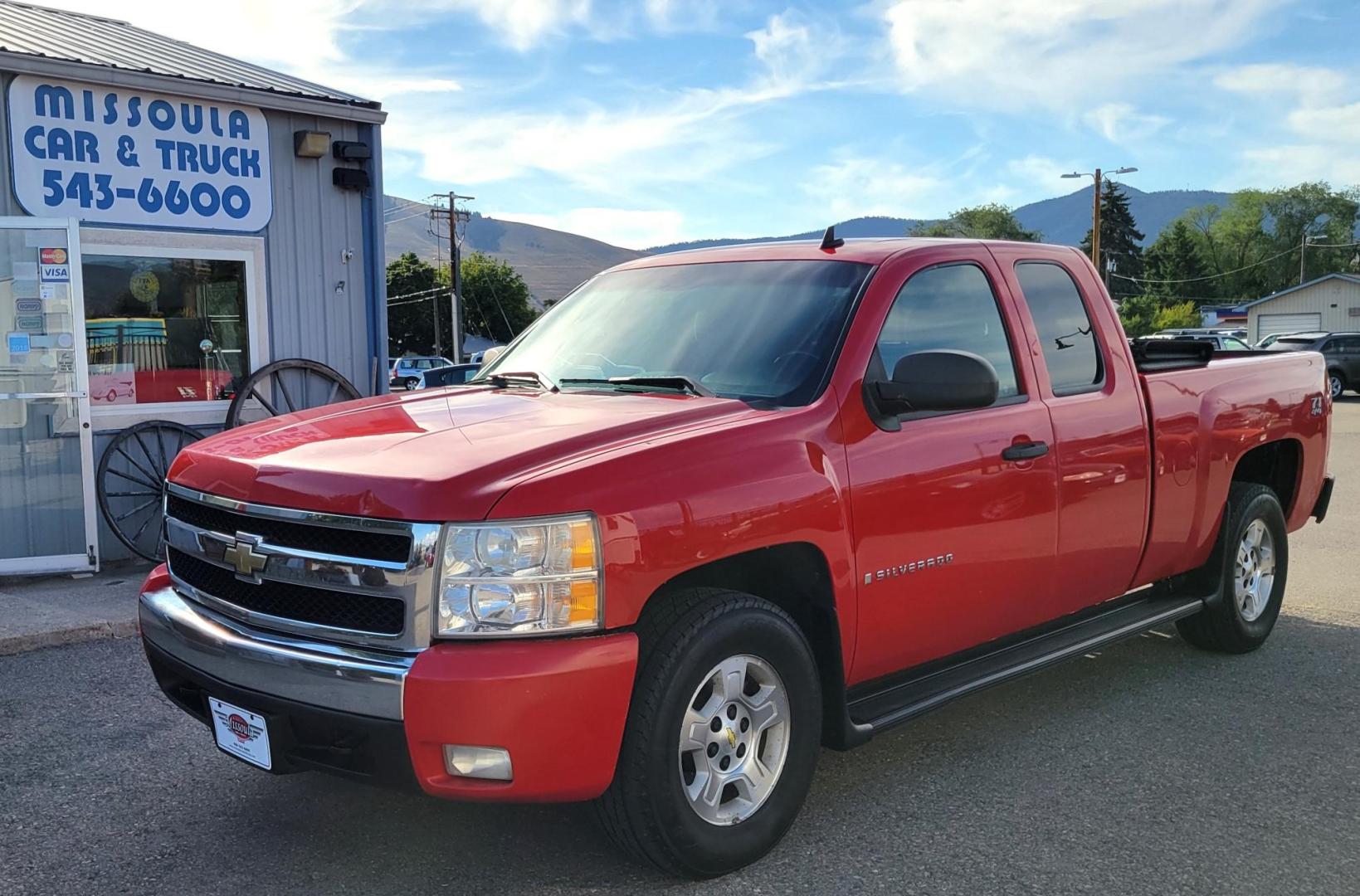 2007 Red /Black Chevrolet Silverado 1500 Z71 Ext. Cab 4WD (2GCEK19J171) with an 5.3L V8 OHV 16V engine, 4-Speed Automatic Overdrive transmission, located at 450 N Russell, Missoula, MT, 59801, (406) 543-6600, 46.874496, -114.017433 - Very Clean 4WD Chevy Truck. 5.3L V8. Automatic Transmission. Power Seats. Air Cruise. Tilt. Running Boards. Power Windows and Locks. Remote Start. AM FM CD. Tonneau Cover. Tires are Excellent. - Photo#0