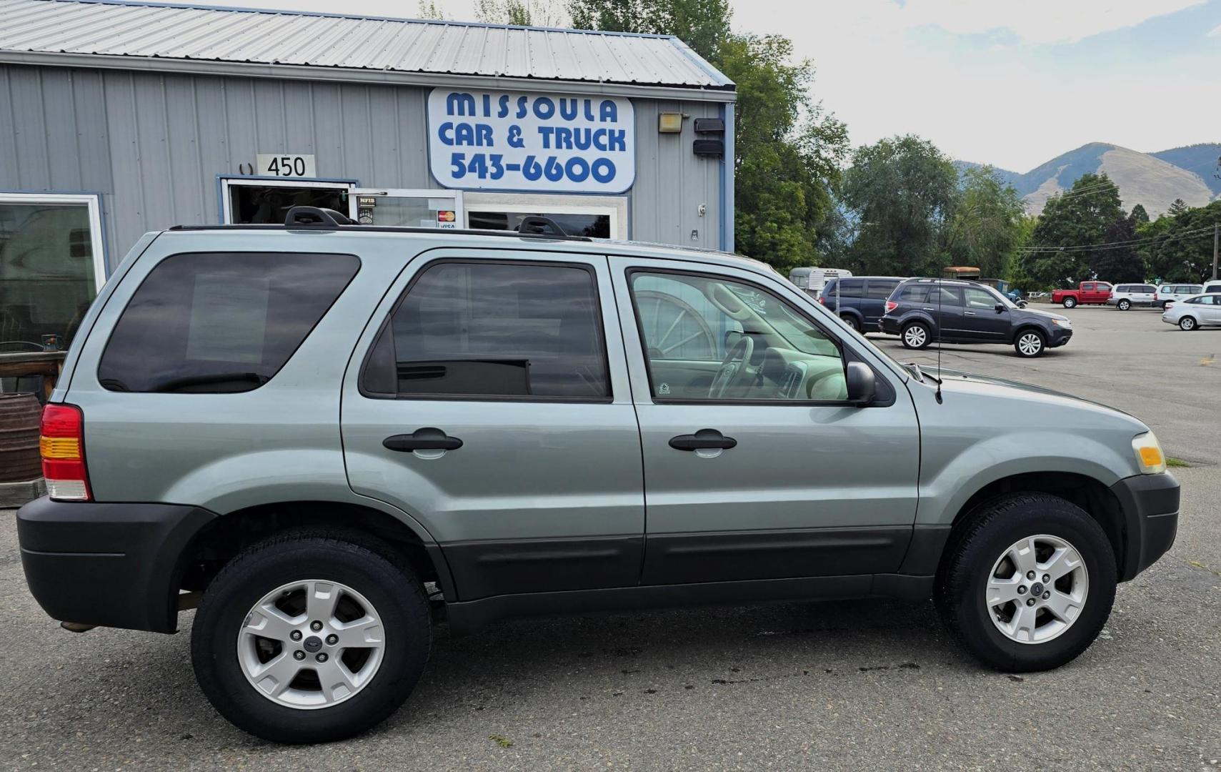 2005 Green /White Ford Escape XLT 4WD (1FMYU93105K) with an 3.0L V6 DOHC 24V engine, 4-Speed Automatic Overdrive transmission, located at 450 N Russell, Missoula, MT, 59801, (406) 543-6600, 46.874496, -114.017433 - Zippy little SUV. 3.0 V6 Engine. Automatic Transmission. AWD. Air. Cruise. Tilt. Power Windows and Locks. Bluetooth Stereo. Great Miles for its age. very Clean. Nice tow hitch, - Photo#0