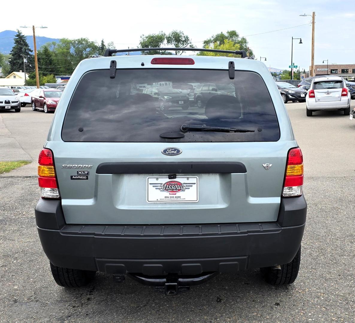 2005 Green /White Ford Escape XLT 4WD (1FMYU93105K) with an 3.0L V6 DOHC 24V engine, 4-Speed Automatic Overdrive transmission, located at 450 N Russell, Missoula, MT, 59801, (406) 543-6600, 46.874496, -114.017433 - Zippy little SUV. 3.0 V6 Engine. Automatic Transmission. AWD. Air. Cruise. Tilt. Power Windows and Locks. Bluetooth Stereo. Great Miles for its age. very Clean. Nice tow hitch, - Photo#1