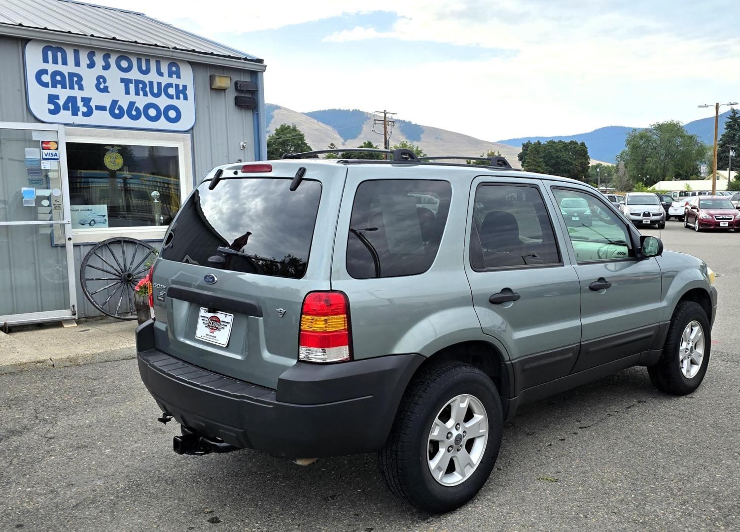 2005 Green /White Ford Escape XLT 4WD (1FMYU93105K) with an 3.0L V6 DOHC 24V engine, 4-Speed Automatic Overdrive transmission, located at 450 N Russell, Missoula, MT, 59801, (406) 543-6600, 46.874496, -114.017433 - Zippy little SUV. 3.0 V6 Engine. Automatic Transmission. AWD. Air. Cruise. Tilt. Power Windows and Locks. Bluetooth Stereo. Great Miles for its age. very Clean. Nice tow hitch, - Photo#2