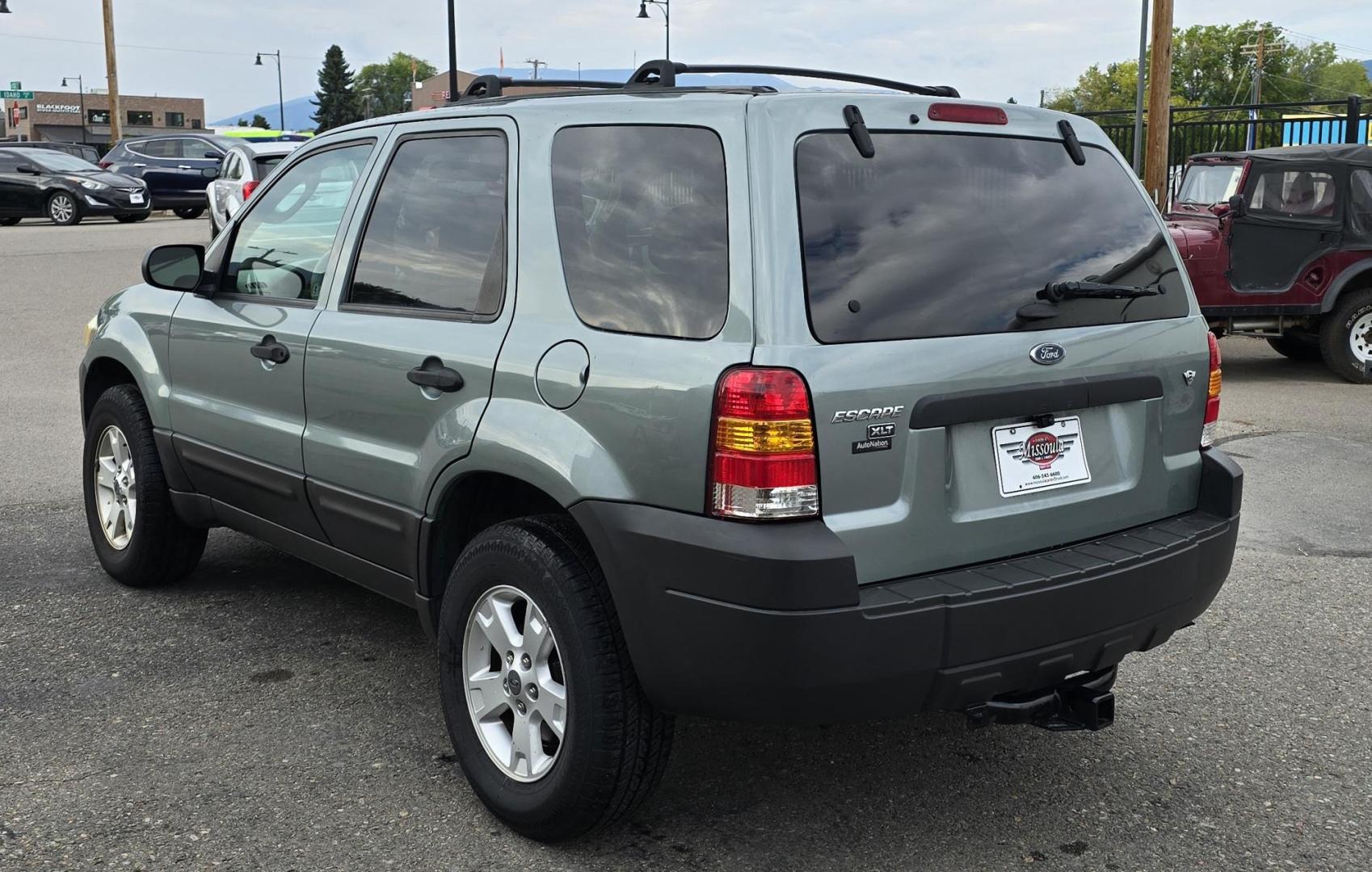 2005 Green /White Ford Escape XLT 4WD (1FMYU93105K) with an 3.0L V6 DOHC 24V engine, 4-Speed Automatic Overdrive transmission, located at 450 N Russell, Missoula, MT, 59801, (406) 543-6600, 46.874496, -114.017433 - Zippy little SUV. 3.0 V6 Engine. Automatic Transmission. AWD. Air. Cruise. Tilt. Power Windows and Locks. Bluetooth Stereo. Great Miles for its age. very Clean. Nice tow hitch, - Photo#3