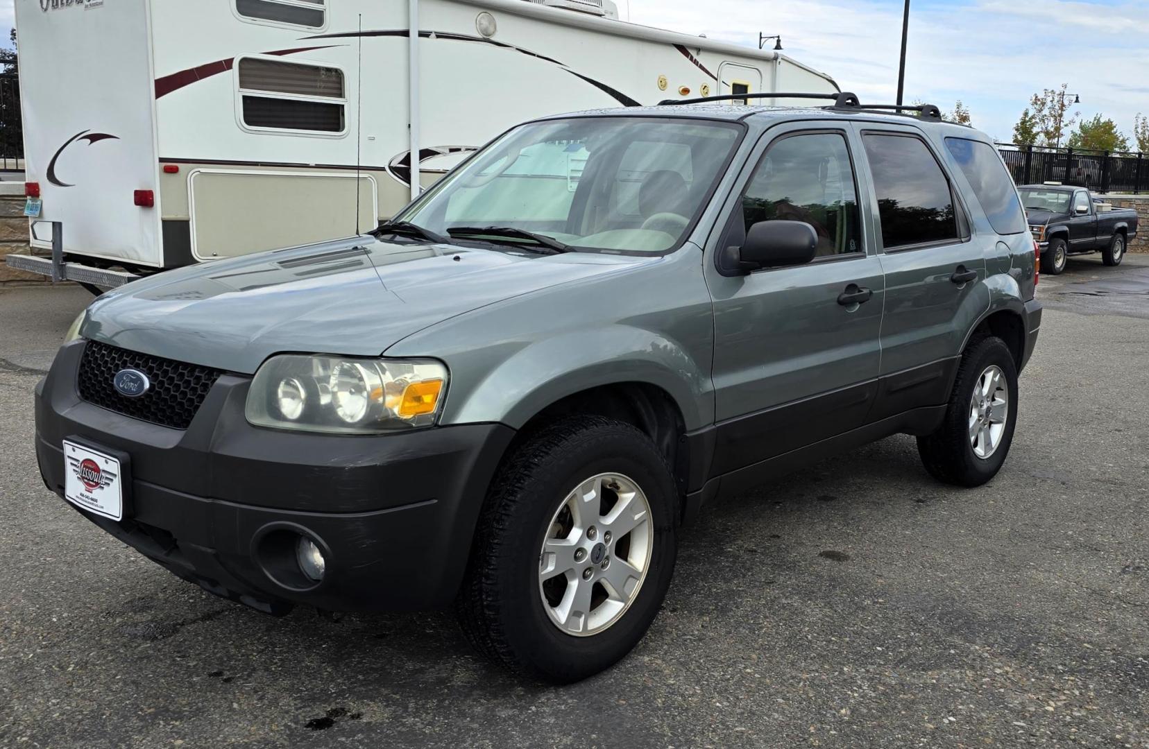 2005 Green /White Ford Escape XLT 4WD (1FMYU93105K) with an 3.0L V6 DOHC 24V engine, 4-Speed Automatic Overdrive transmission, located at 450 N Russell, Missoula, MT, 59801, (406) 543-6600, 46.874496, -114.017433 - Zippy little SUV. 3.0 V6 Engine. Automatic Transmission. AWD. Air. Cruise. Tilt. Power Windows and Locks. Bluetooth Stereo. Great Miles for its age. very Clean. Nice tow hitch, - Photo#4