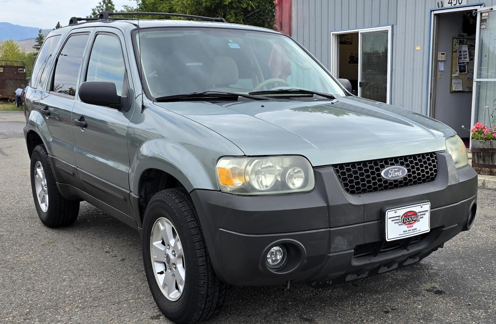 2005 Green /White Ford Escape XLT 4WD (1FMYU93105K) with an 3.0L V6 DOHC 24V engine, 4-Speed Automatic Overdrive transmission, located at 450 N Russell, Missoula, MT, 59801, (406) 543-6600, 46.874496, -114.017433 - Zippy little SUV. 3.0 V6 Engine. Automatic Transmission. AWD. Air. Cruise. Tilt. Power Windows and Locks. Bluetooth Stereo. Great Miles for its age. very Clean. Nice tow hitch, - Photo#7