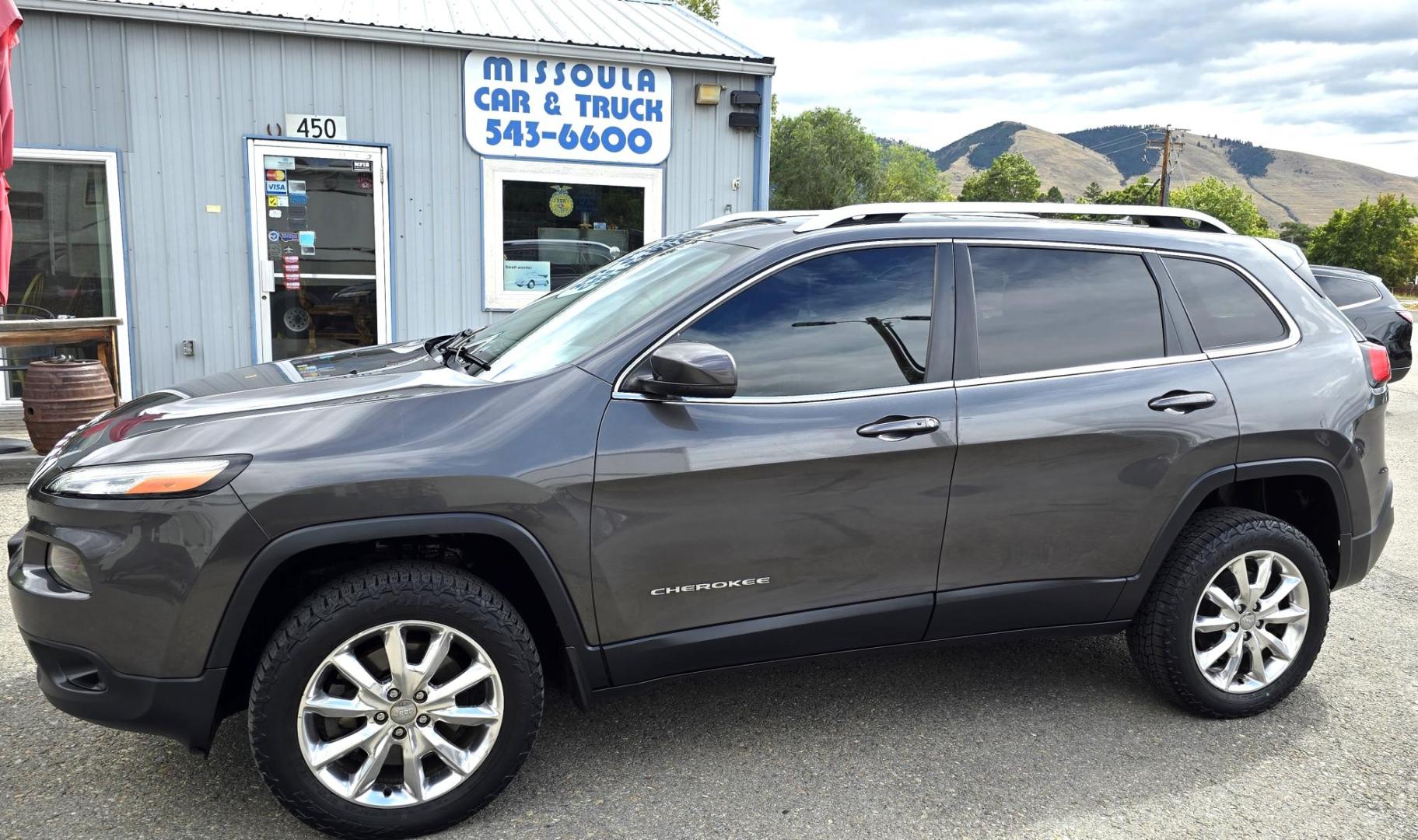 2014 Grey /Black Jeep Cherokee Limited 4WD (1C4PJMDS8EW) with an 3.2L V6 DOHC 24V engine, 9-Speed Automatic transmission, located at 450 N Russell, Missoula, MT, 59801, (406) 543-6600, 46.874496, -114.017433 - Clean 4WD Jeep Cherokee. Power Sunroof. heated and Cooled Leather Seats. Heated Steering Wheel. Bluetooth. Backup Camera. Navigation. Air. Cruise. Tilt. Power Windows and Locks. - Photo#2