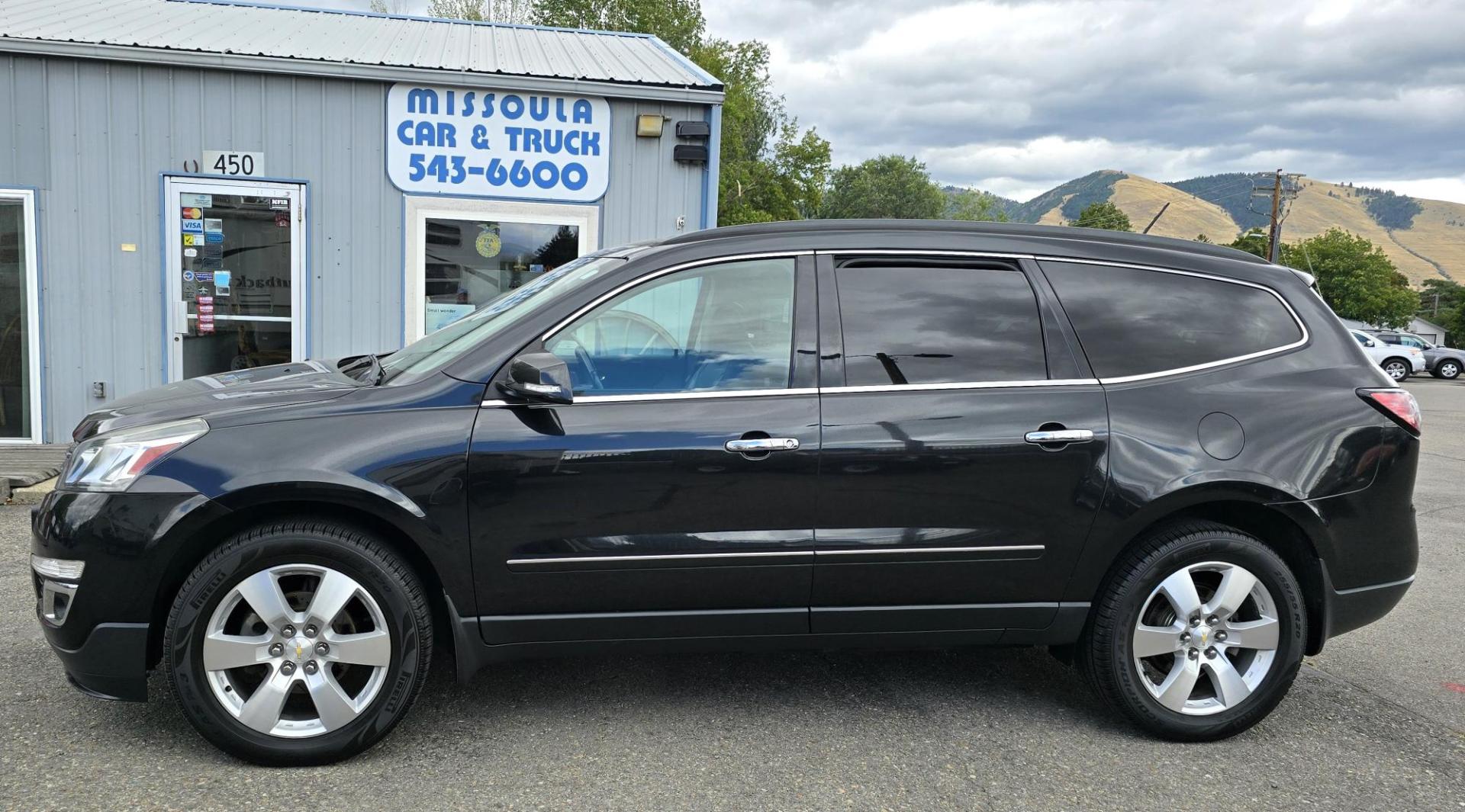 2014 Black /Black Chevrolet Traverse LTZ AWD (1GNKVJKD8EJ) with an 3.6L V6 DOHC 24V engine, 6-Speed Automatic transmission, located at 450 N Russell, Missoula, MT, 59801, (406) 543-6600, 46.874496, -114.017433 - Beautiful Loaded AWD Chevy. 3.6L V6 Engine. Automatic Transmission. Two Sun Roofs. Rear Entertainment. Heated and Cooled Front Seats. Middle Seats are Buckets with Arm Rests. 3rd Row Seating. Bluetooth Audio and Phone Connectivity. Excellent Tires. Front and Rear Climate Control. Bose Sound System. - Photo#0