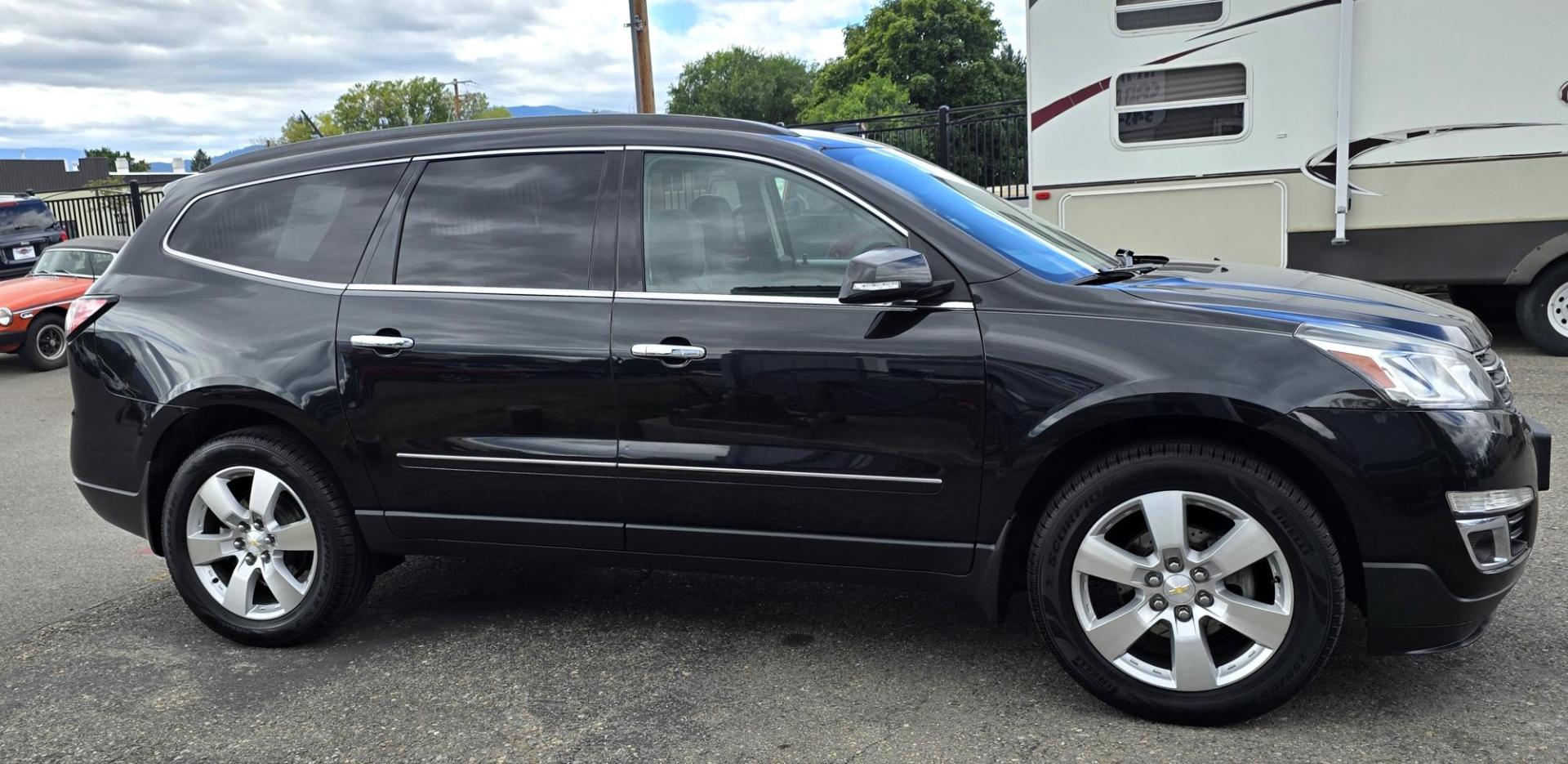 2014 Black /Black Chevrolet Traverse LTZ AWD (1GNKVJKD8EJ) with an 3.6L V6 DOHC 24V engine, 6-Speed Automatic transmission, located at 450 N Russell, Missoula, MT, 59801, (406) 543-6600, 46.874496, -114.017433 - Beautiful Loaded AWD Chevy. 3.6L V6 Engine. Automatic Transmission. Two Sun Roofs. Rear Entertainment. Heated and Cooled Front Seats. Middle Seats are Buckets with Arm Rests. 3rd Row Seating. Bluetooth Audio and Phone Connectivity. Excellent Tires. Front and Rear Climate Control. Bose Sound System. - Photo#4