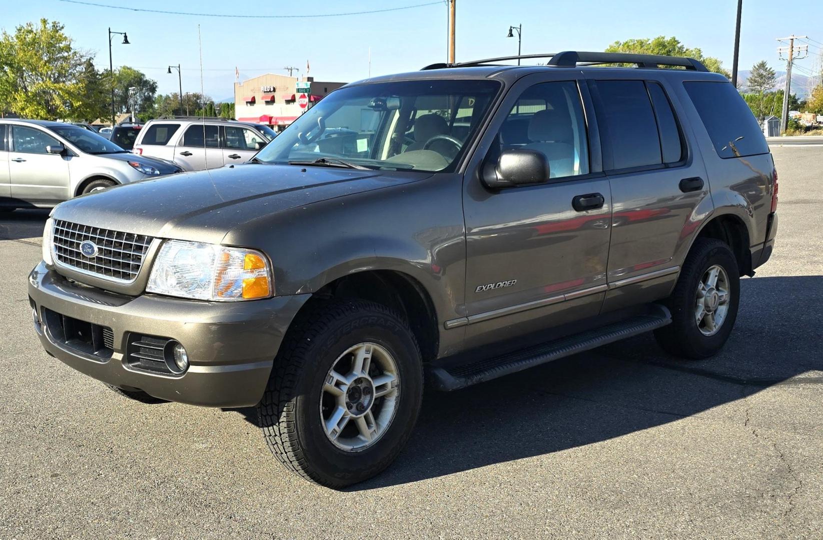 2005 Grey /Gray Ford Explorer XLT 4.0L 4WD (1FMZU73K95U) with an 4.0L V6 SOHC 12V FFV engine, 5-Speed Automatic Overdrive transmission, located at 450 N Russell, Missoula, MT, 59801, (406) 543-6600, 46.874496, -114.017433 - Good running 4WD SUV. 4.0 V6 Engine. Automatic Transmission. 3rd Row seating. Air Cruise Tilt. Power Windows and Locks. All works. Airbag was deployed at one point so there is an airbag light on. 4WD works well. Seems solid. New tires. I know its a little rough but it's well worth the price for a ru - Photo#0