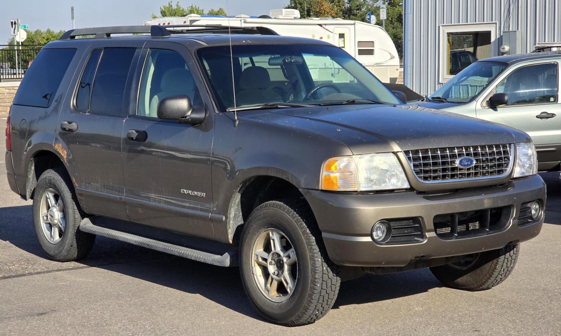 2005 Grey /Gray Ford Explorer XLT 4.0L 4WD (1FMZU73K95U) with an 4.0L V6 SOHC 12V FFV engine, 5-Speed Automatic Overdrive transmission, located at 450 N Russell, Missoula, MT, 59801, (406) 543-6600, 46.874496, -114.017433 - Good running 4WD SUV. 4.0 V6 Engine. Automatic Transmission. 3rd Row seating. Air Cruise Tilt. Power Windows and Locks. All works. Airbag was deployed at one point so there is an airbag light on. 4WD works well. Seems solid. New tires. I know its a little rough but it's well worth the price for a ru - Photo#1