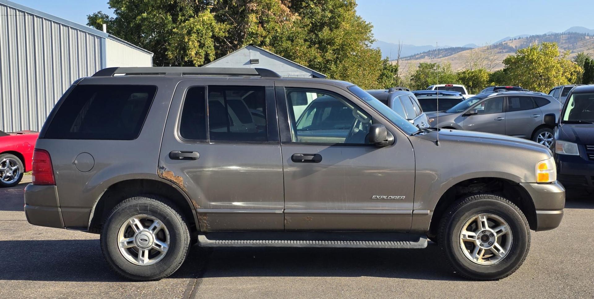 2005 Grey /Gray Ford Explorer XLT 4.0L 4WD (1FMZU73K95U) with an 4.0L V6 SOHC 12V FFV engine, 5-Speed Automatic Overdrive transmission, located at 450 N Russell, Missoula, MT, 59801, (406) 543-6600, 46.874496, -114.017433 - Good running 4WD SUV. 4.0 V6 Engine. Automatic Transmission. 3rd Row seating. Air Cruise Tilt. Power Windows and Locks. All works. Airbag was deployed at one point so there is an airbag light on. 4WD works well. Seems solid. New tires. I know its a little rough but it's well worth the price for a ru - Photo#3