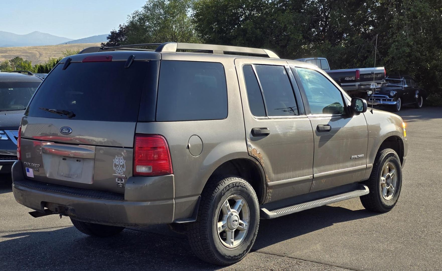 2005 Grey /Gray Ford Explorer XLT 4.0L 4WD (1FMZU73K95U) with an 4.0L V6 SOHC 12V FFV engine, 5-Speed Automatic Overdrive transmission, located at 450 N Russell, Missoula, MT, 59801, (406) 543-6600, 46.874496, -114.017433 - Good running 4WD SUV. 4.0 V6 Engine. Automatic Transmission. 3rd Row seating. Air Cruise Tilt. Power Windows and Locks. All works. Airbag was deployed at one point so there is an airbag light on. 4WD works well. Seems solid. New tires. I know its a little rough but it's well worth the price for a ru - Photo#4