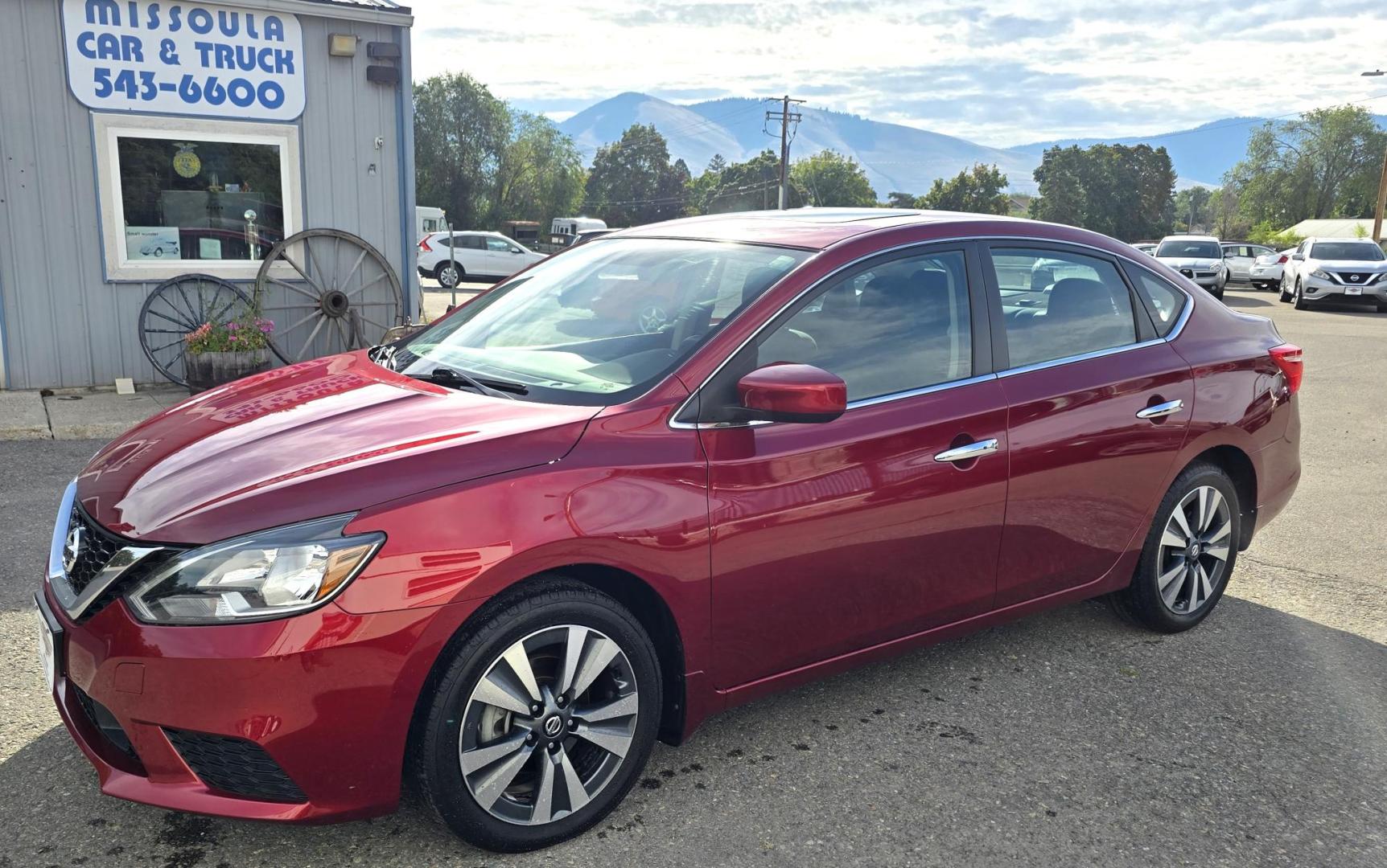 2019 Red /Black Nissan Sentra SV Special Edition (3N1AB7APXKY) with an 1.8L L4 SFI DOHC 16V engine, CVT transmission, located at 450 N Russell, Missoula, MT, 59801, (406) 543-6600, 46.874496, -114.017433 - Really Clean One Owner Sedan. Clean Carfax. 1.8L I4 Engine. FWD Automatic Transmission. Air. Cruise. Tilt. Power Sunroof. AM FM XM Bluetooth. Backup Camera. Special Edition features include: 17" Alloy Wheels. Wheels, Adaptive Cruise Control and Blindspot Monitor. - Photo#0