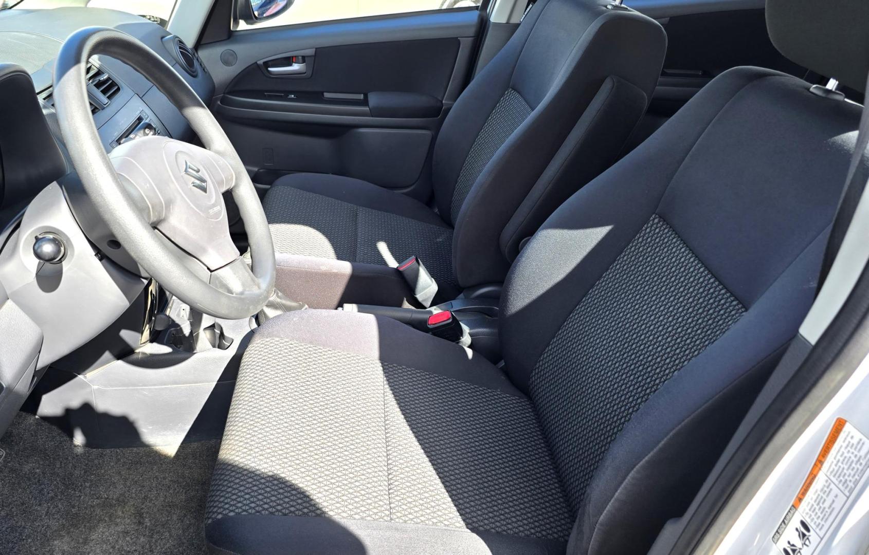 2013 White /Black Suzuki SX4 Crossover Premium AWD (JS2YB5A32D6) with an 2.0L L4 DOHC 16V engine, 6 Speed Manual transmission, located at 450 N Russell, Missoula, MT, 59801, (406) 543-6600, 46.874496, -114.017433 - Cute Little economy AWD in excellent Condition. 2.0L I4 Engine. 6 Speed Manual Transmission. Power Windows and Locks. Air conditioning. One Owner. Clean Carfax. - Photo#11