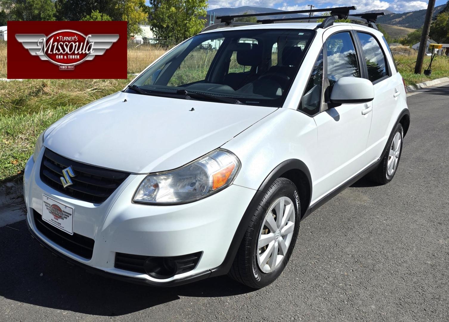 2013 White /Black Suzuki SX4 Crossover Premium AWD (JS2YB5A32D6) with an 2.0L L4 DOHC 16V engine, 6 Speed Manual transmission, located at 450 N Russell, Missoula, MT, 59801, (406) 543-6600, 46.874496, -114.017433 - Cute Little economy AWD in excellent Condition. 2.0L I4 Engine. 6 Speed Manual Transmission. Power Windows and Locks. Air conditioning. One Owner. Clean Carfax. - Photo#2