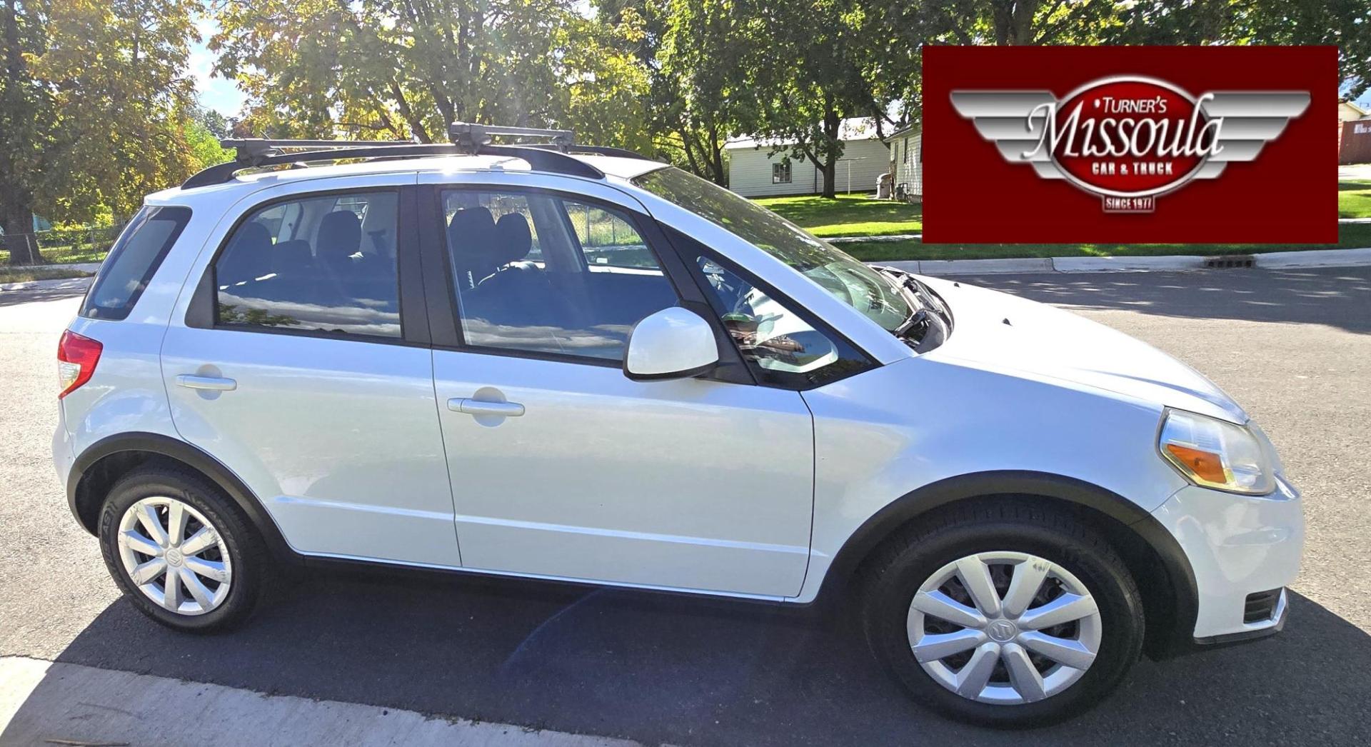 2013 White /Black Suzuki SX4 Crossover Premium AWD (JS2YB5A32D6) with an 2.0L L4 DOHC 16V engine, 6 Speed Manual transmission, located at 450 N Russell, Missoula, MT, 59801, (406) 543-6600, 46.874496, -114.017433 - Cute Little economy AWD in excellent Condition. 2.0L I4 Engine. 6 Speed Manual Transmission. Power Windows and Locks. Air conditioning. One Owner. Clean Carfax. - Photo#4