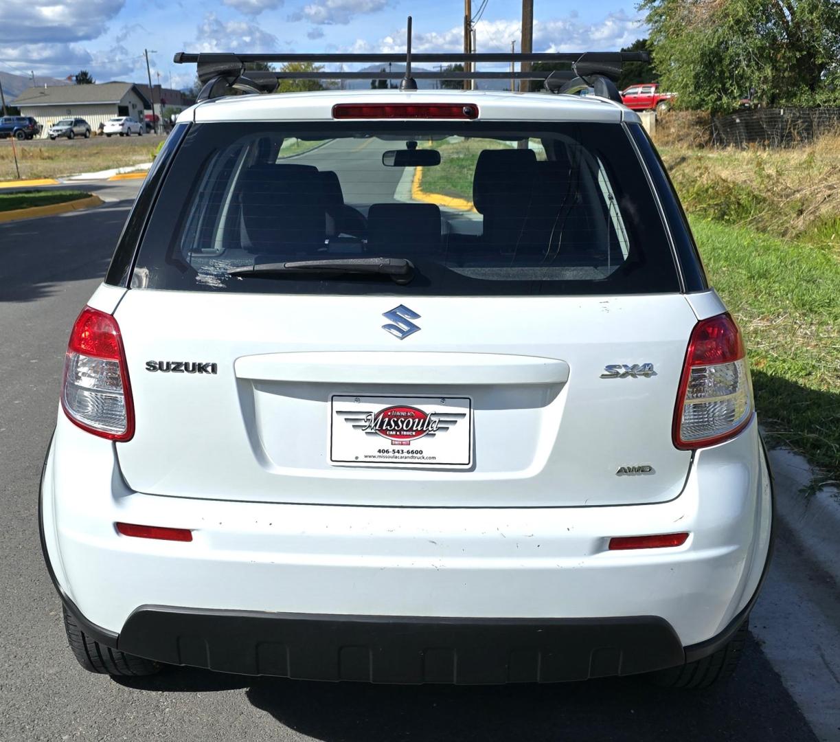 2013 White /Black Suzuki SX4 Crossover Premium AWD (JS2YB5A32D6) with an 2.0L L4 DOHC 16V engine, 6 Speed Manual transmission, located at 450 N Russell, Missoula, MT, 59801, (406) 543-6600, 46.874496, -114.017433 - Cute Little economy AWD in excellent Condition. 2.0L I4 Engine. 6 Speed Manual Transmission. Power Windows and Locks. Air conditioning. One Owner. Clean Carfax. - Photo#5