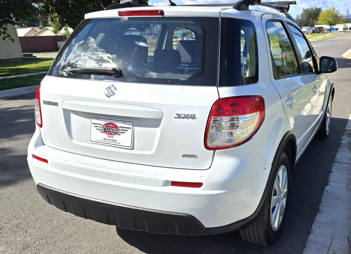 2013 White /Black Suzuki SX4 Crossover Premium AWD (JS2YB5A32D6) with an 2.0L L4 DOHC 16V engine, 6 Speed Manual transmission, located at 450 N Russell, Missoula, MT, 59801, (406) 543-6600, 46.874496, -114.017433 - Cute Little economy AWD in excellent Condition. 2.0L I4 Engine. 6 Speed Manual Transmission. Power Windows and Locks. Air conditioning. One Owner. Clean Carfax. - Photo#6