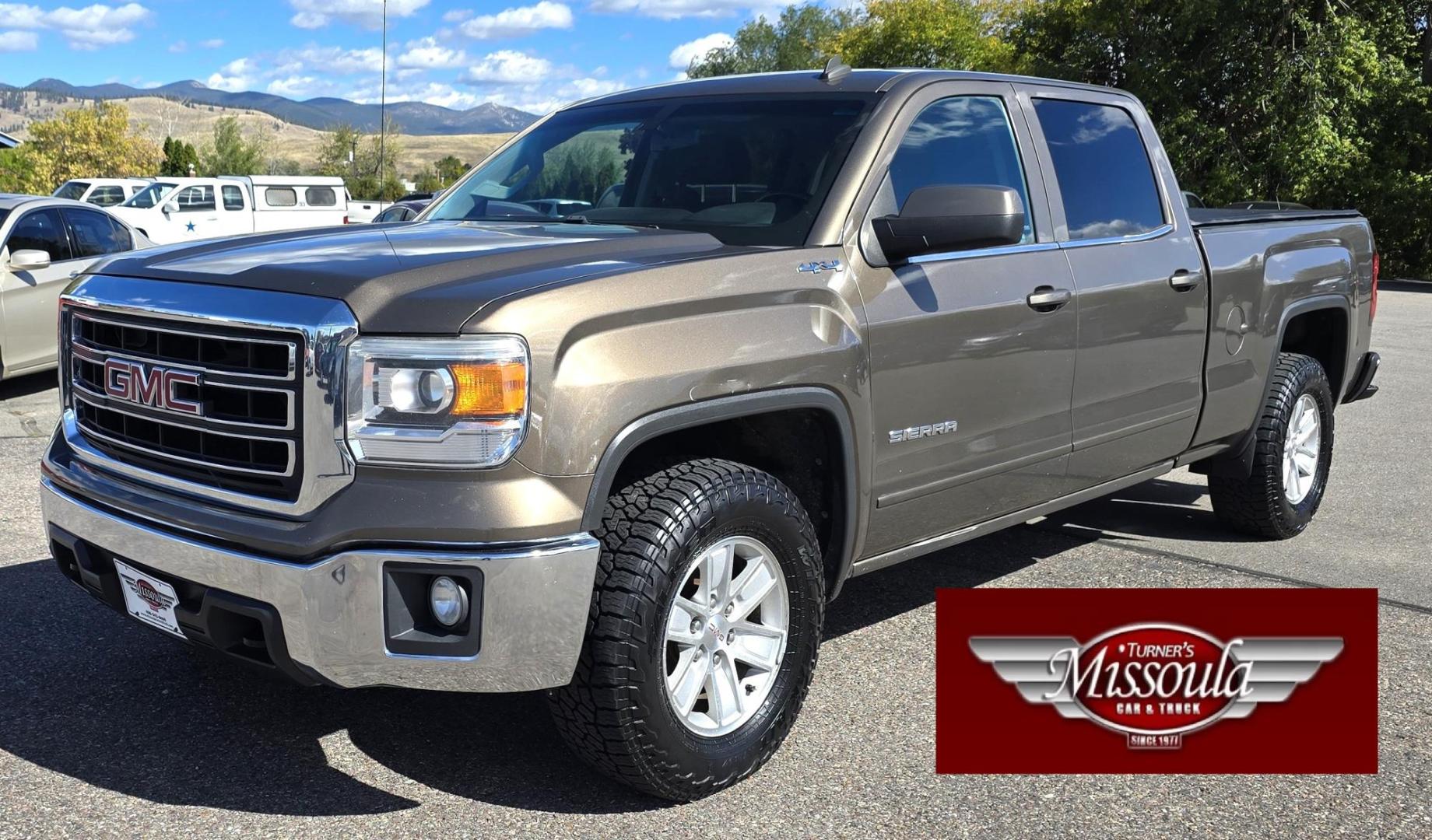 2014 Bronze /Black GMC Sierra 1500 SLE Crew Cab 4WD (3GTU2UEC9EG) with an 5.3L V8 OHV 16V engine, 6-Speed Automatic transmission, located at 450 N Russell, Missoula, MT, 59801, (406) 543-6600, 46.874496, -114.017433 - 1/2 Ton 4WD GMC in Good Condition. Drivers Seats has a small tear. 5.3L V8. Automatic Transmission. Power Drivers Seat. Heated Seats. Navigation. AM FM XM Bluetooth. backup Camera. Tonneau Cover. Towing Package. Beefy Tires. Good fuel economy for it's size. - Photo#0