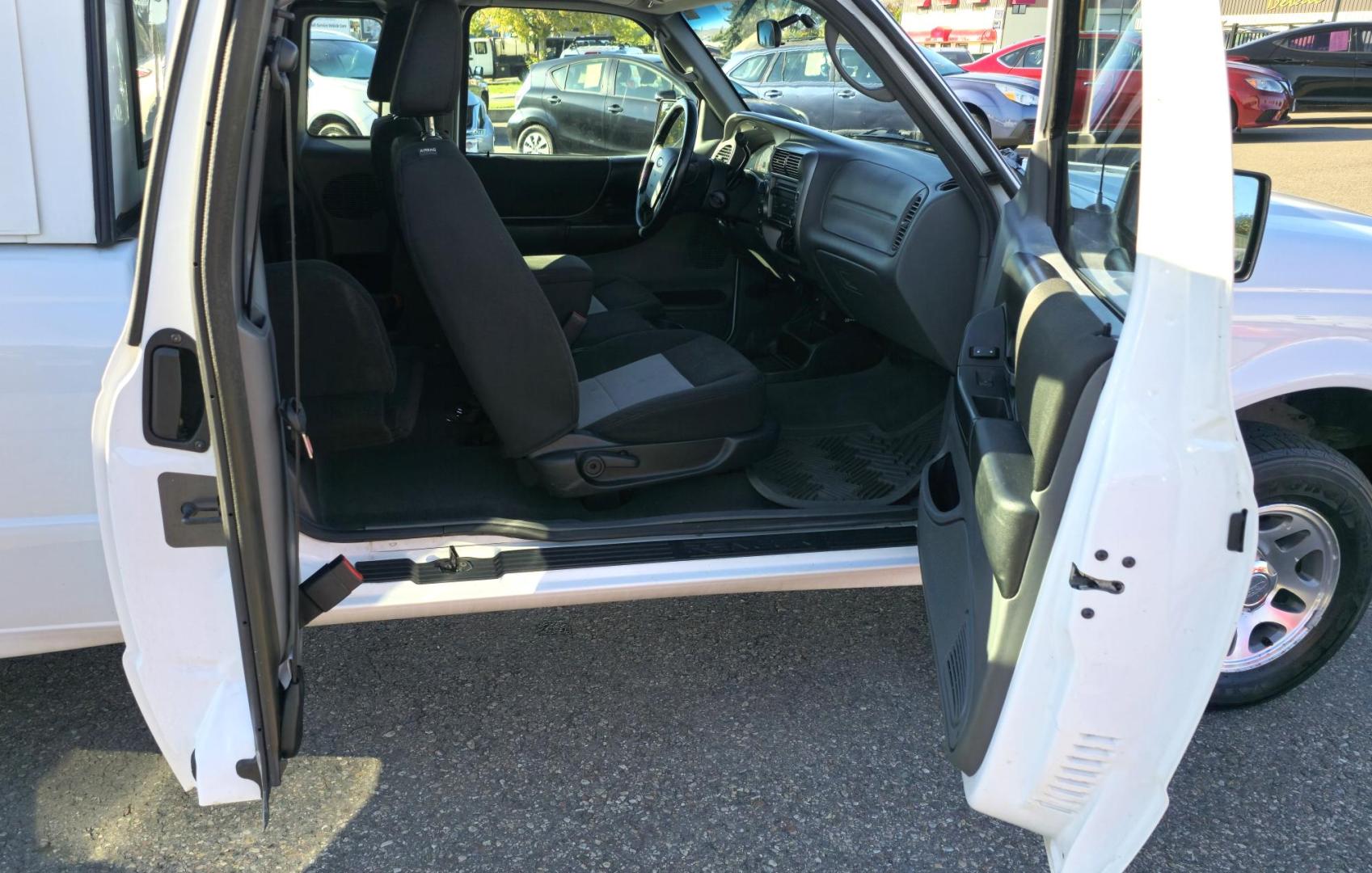 2011 White /Black Ford Ranger XLT SuperCab 4-Door 4WD (1FTLR4FE5BP) with an 4.0L V6 SOHC 12V engine, Automatic transmission, located at 450 N Russell, Missoula, MT, 59801, (406) 543-6600, 46.874496, -114.017433 - Former Animal Control Truck with Topper. 4 Wheel Drive. 4.0L V6 Engine. Automatic Transmission. Air Cruise Tilt. Power Windows and Locks. Towing. Runs Well. Would make a great small 4WD for a Bird Hunter with his dog. - Photo#13