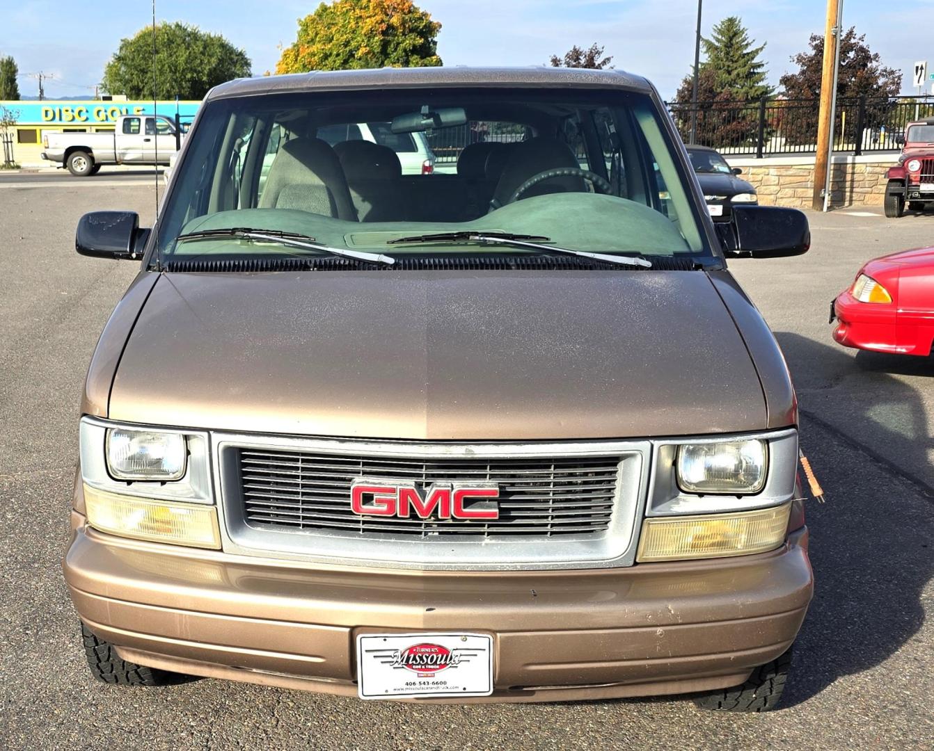 1999 Gold /Tan GMC Safari Passenger Van AWD (1GKEL19WXXB) with an 4.3L V6 OHV 12V engine, 4-Speed Automatic Overdrive transmission, located at 450 N Russell, Missoula, MT, 59801, (406) 543-6600, 46.874496, -114.017433 - Hard to Find AWD Safari / Astro Van. Great Miles. Only 119K Miles. 4.3L V6 Engine. Automatic Transmission. 3rd Row Seating. Front and Real Air. AM FM Cassette, Runs Amazing. New Tires! Financing is not available on this vehicle. - Photo#5