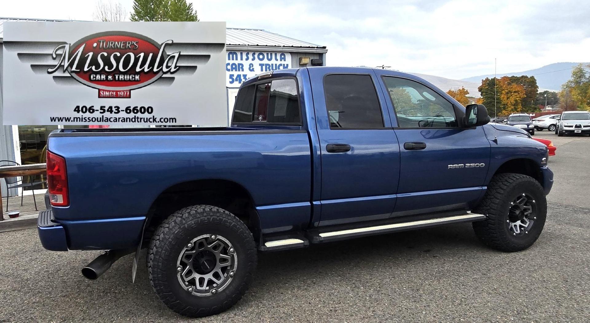 2003 Blue /Black Dodge Ram 2500 Laramie Quad Cab Long Bed 4WD (3D7KU28C13G) with an 5.9L L6 OHV 24V TURBO DIESEL engine, 6 Speed Manual transmission, located at 450 N Russell, Missoula, MT, 59801, (406) 543-6600, 46.874496, -114.017433 - Nice 5.9 Diesel 4WD Pickup. Hard to find 6 Speed Manual Transmission. Great Miles for it's age. Air Cruise. Tilt. Power Windows and Locks. Power Drivers Seat. Running Boards. Nice Tires and Wheels. Towing. Because of the age of this vehicle, financing is NOT available. - Photo#1