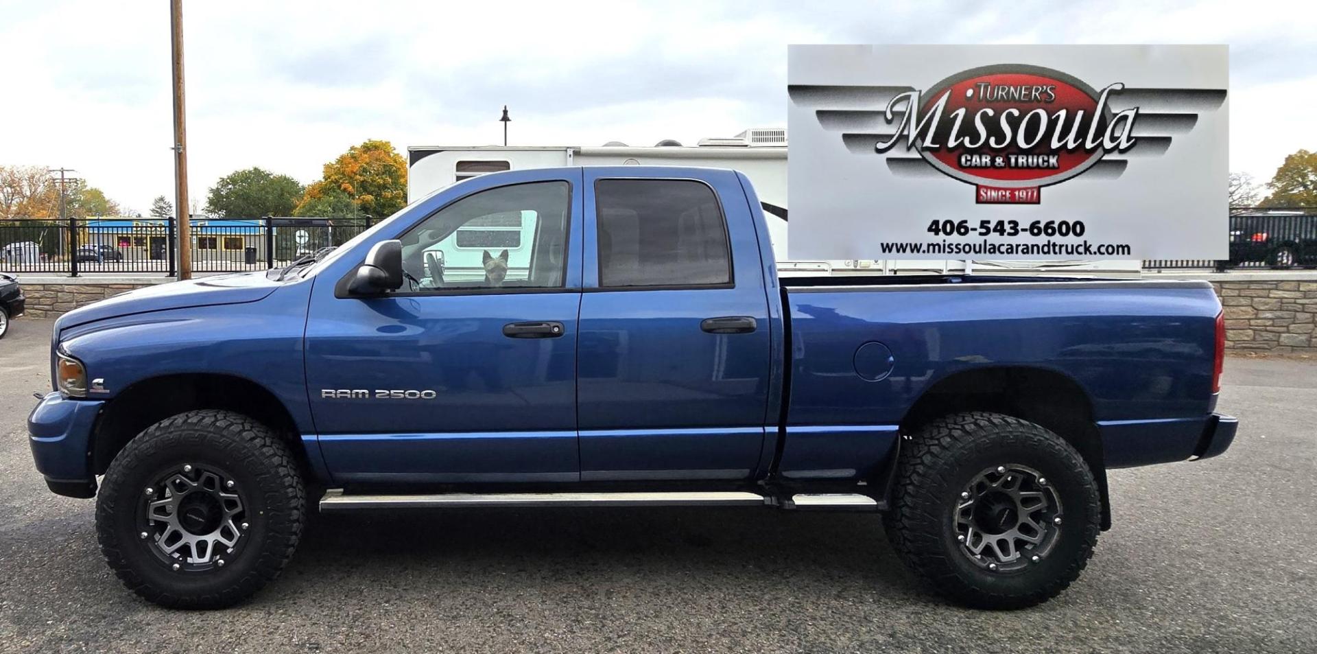 2003 Blue /Black Dodge Ram 2500 Laramie Quad Cab Long Bed 4WD (3D7KU28C13G) with an 5.9L L6 OHV 24V TURBO DIESEL engine, 6 Speed Manual transmission, located at 450 N Russell, Missoula, MT, 59801, (406) 543-6600, 46.874496, -114.017433 - Photo#0