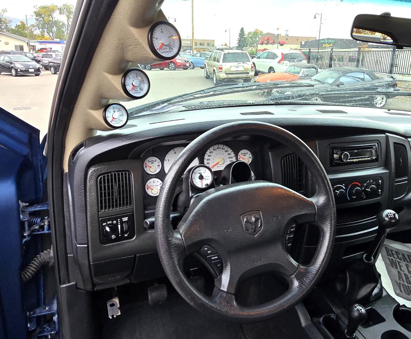 2003 Blue /Black Dodge Ram 2500 Laramie Quad Cab Long Bed 4WD (3D7KU28C13G) with an 5.9L L6 OHV 24V TURBO DIESEL engine, 6 Speed Manual transmission, located at 450 N Russell, Missoula, MT, 59801, (406) 543-6600, 46.874496, -114.017433 - Nice 5.9 Diesel 4WD Pickup. Hard to find 6 Speed Manual Transmission. Great Miles for it's age. Air Cruise. Tilt. Power Windows and Locks. Power Drivers Seat. Running Boards. Nice Tires and Wheels. Towing. Because of the age of this vehicle, financing is NOT available. - Photo#16