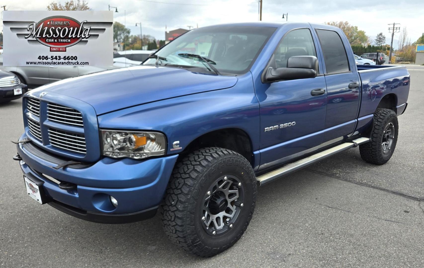 2003 Blue /Black Dodge Ram 2500 Laramie Quad Cab Long Bed 4WD (3D7KU28C13G) with an 5.9L L6 OHV 24V TURBO DIESEL engine, 6 Speed Manual transmission, located at 450 N Russell, Missoula, MT, 59801, (406) 543-6600, 46.874496, -114.017433 - Photo#7