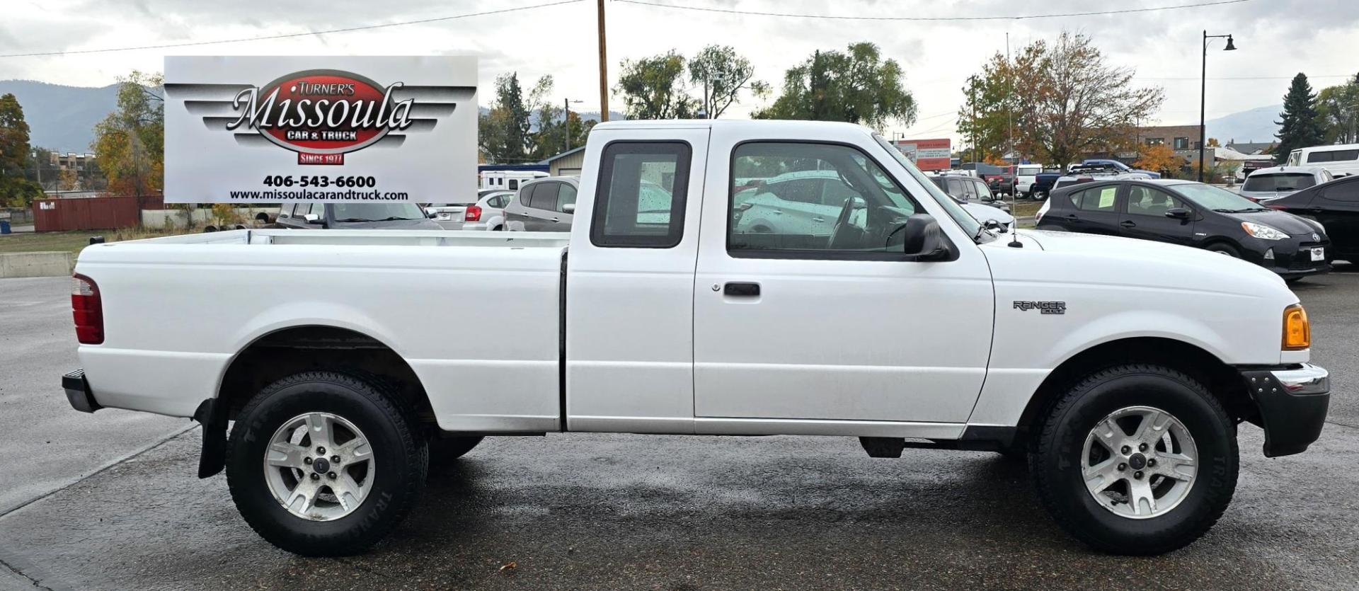 2004 White /Black Ford Ranger XLT SuperCab 2-Door 4WD (1FTYR15E64P) with an 4.0L V6 SOHC 12V engine, Automatic transmission, located at 450 N Russell, Missoula, MT, 59801, (406) 543-6600, 46.874496, -114.017433 - Low Mile 4WD Ranger. 4.0L V6 Engine. Automatic Transmission. Air conditioning. AM FM CD Player. 2 Owner. Clean Title and Carfax. Because of the age, financing is not available on this vehicle. - Photo#2