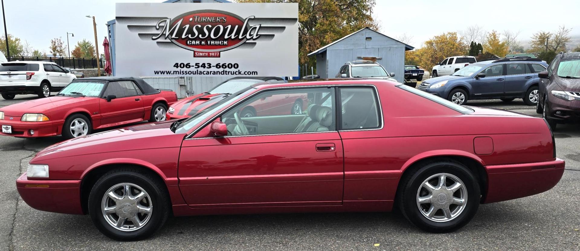 1999 Red /Black Cadillac Eldorado Touring Coupe (1G6ET129XXU) with an 4.6L V8 DOHC 32V engine, 4-Speed Automatic Overdrive transmission, located at 450 N Russell, Missoula, MT, 59801, (406) 543-6600, 46.874496, -114.017433 - Super Clean FWD Eldorado. Only 93K Miles. Excellent Condition. 4.6L V8 Engine. Automatic. Lather Heated Power Seats, Power Sunroof. Power Windows and Locks. AM FM CD. Air. Cruise. Tilt. Because of the age, this vehicle, financing is NOT available. - Photo#1