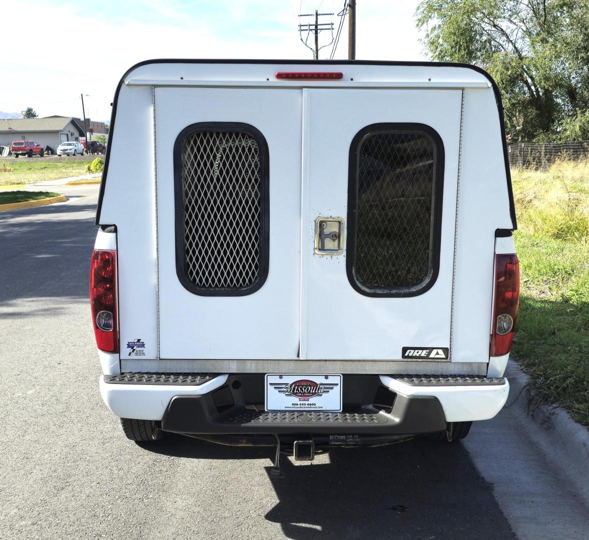 2012 White /Black Chevrolet Colorado Work Truck Ext. Cab 4WD (1GCJTBF95C8) with an 2.9L L4 DOHC 16V engine, Automatic transmission, located at 450 N Russell, Missoula, MT, 59801, (406) 543-6600, 46.874496, -114.017433 - Hard to find Colorado 4WD. 2.9L I4 Engine. Automatic. Former Animal Control Truck so it has a really nice Topper. Air Conditioning. Power Windows and Locks. Cruise Control. AM FM CD. - Photo#3