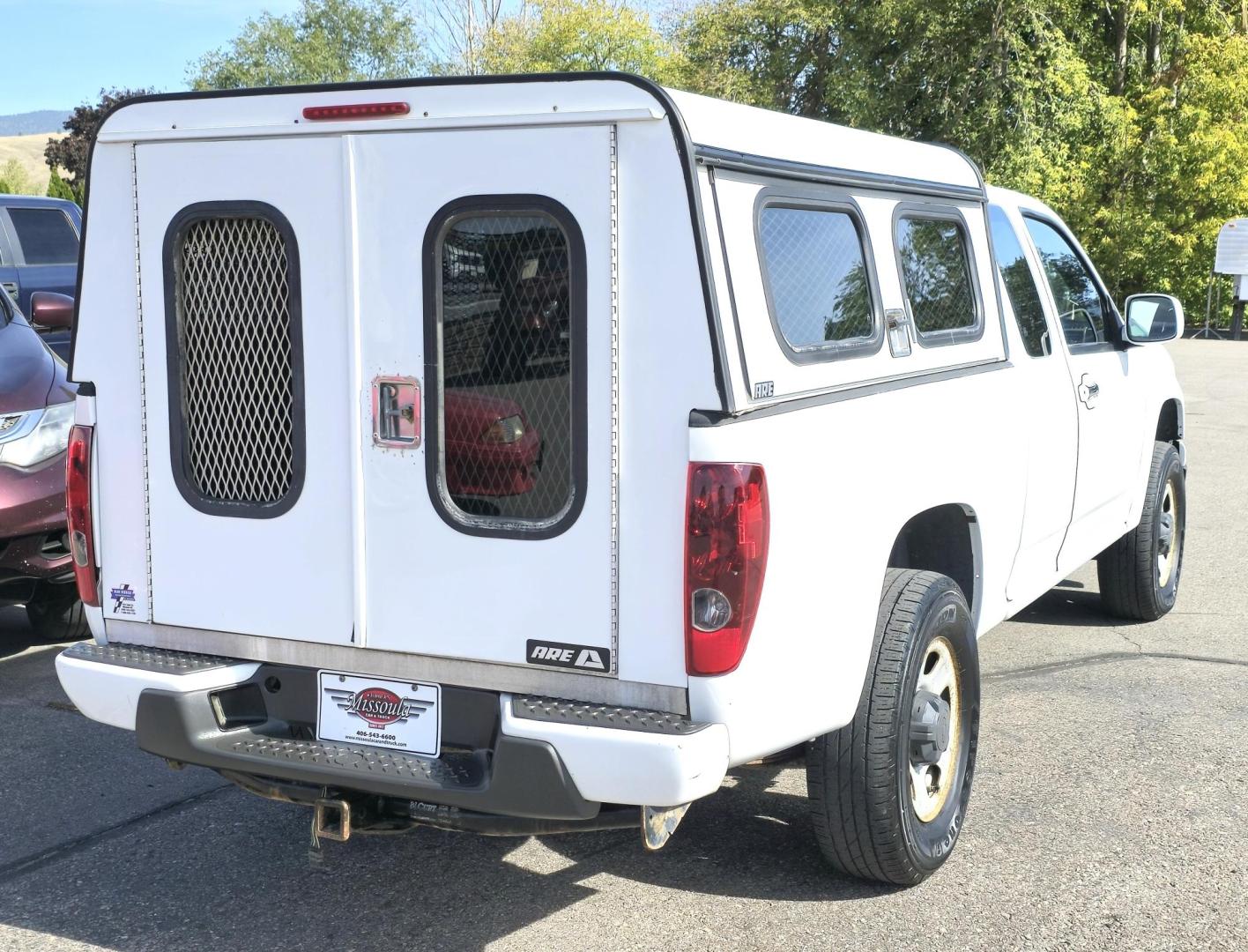 2012 White /Black Chevrolet Colorado Work Truck Ext. Cab 4WD (1GCJTBF95C8) with an 2.9L L4 DOHC 16V engine, Automatic transmission, located at 450 N Russell, Missoula, MT, 59801, (406) 543-6600, 46.874496, -114.017433 - Hard to find Colorado 4WD. 2.9L I4 Engine. Automatic. Former Animal Control Truck so it has a really nice Topper. Air Conditioning. Power Windows and Locks. Cruise Control. AM FM CD. - Photo#8