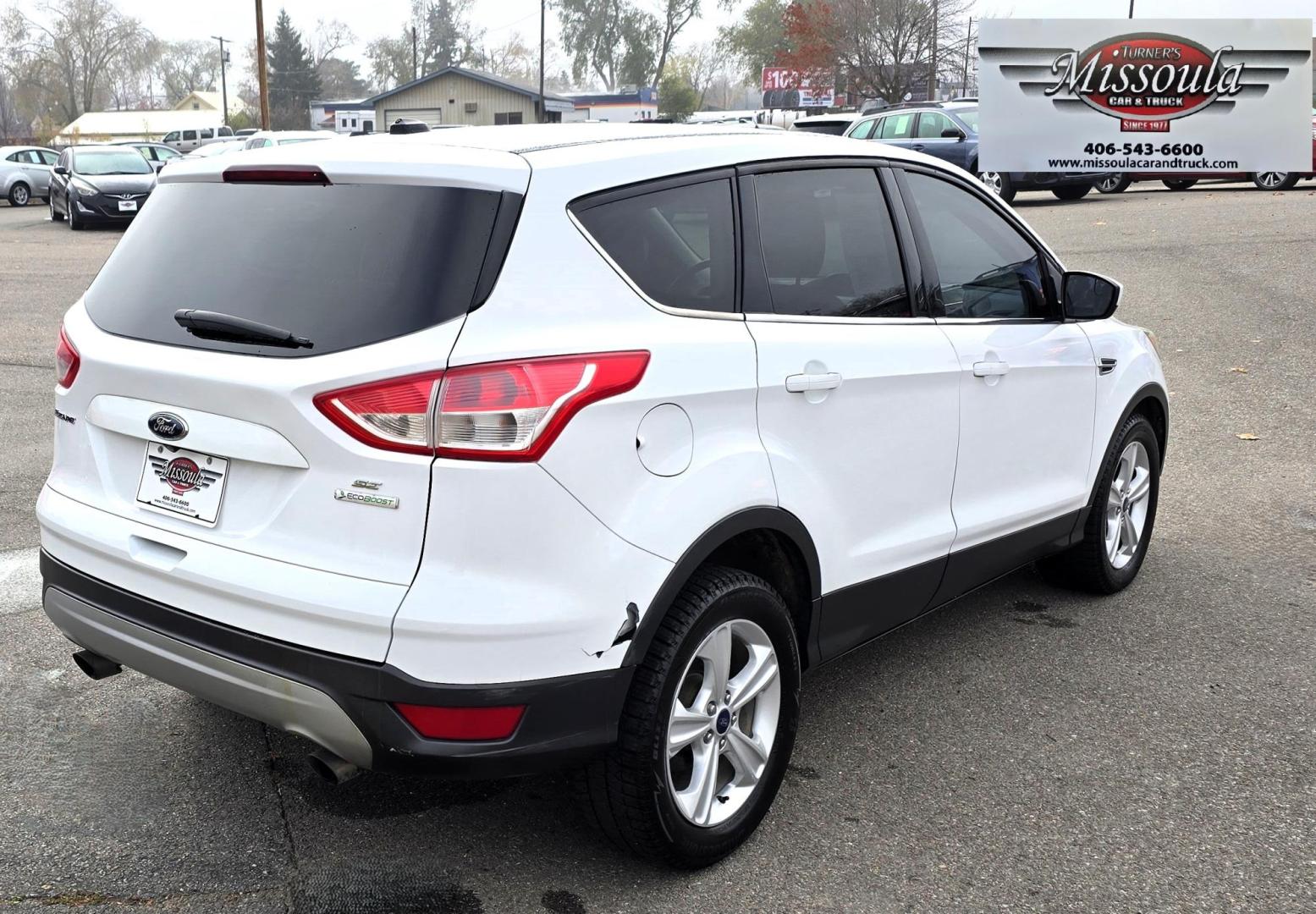 2014 White /Black Ford Escape SE FWD (1FMCU0GXXEU) with an 1.6L L4 DOHC 16V engine, 6-Speed Automatic transmission, located at 450 N Russell, Missoula, MT, 59801, (406) 543-6600, 46.874496, -114.017433 - Great Running Ford Escape EcoBoost. Front Wheel Drive. 1.6L I4 Engine. 6 Speed Automatic. Air. Cruise. Tilt. Power Windows and Locks. AM FM XM CD. Bluetooth Audio and Phone. Nice Bridgestone Tires. - Photo#2