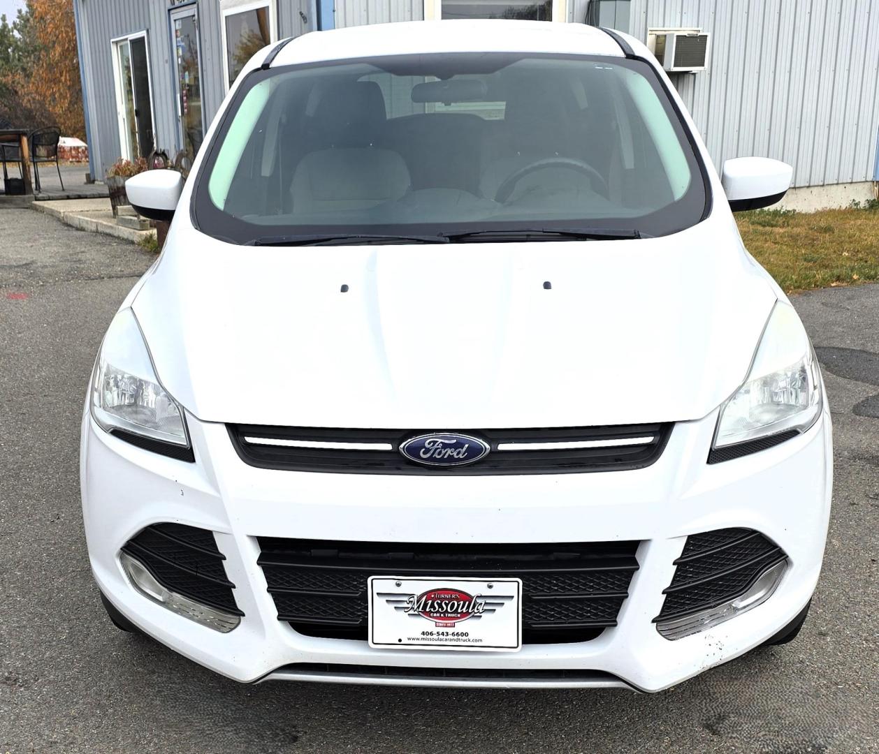 2014 White /Black Ford Escape SE FWD (1FMCU0GXXEU) with an 1.6L L4 DOHC 16V engine, 6-Speed Automatic transmission, located at 450 N Russell, Missoula, MT, 59801, (406) 543-6600, 46.874496, -114.017433 - Great Running Ford Escape EcoBoost. Front Wheel Drive. 1.6L I4 Engine. 6 Speed Automatic. Air. Cruise. Tilt. Power Windows and Locks. AM FM XM CD. Bluetooth Audio and Phone. Nice Bridgestone Tires. - Photo#6