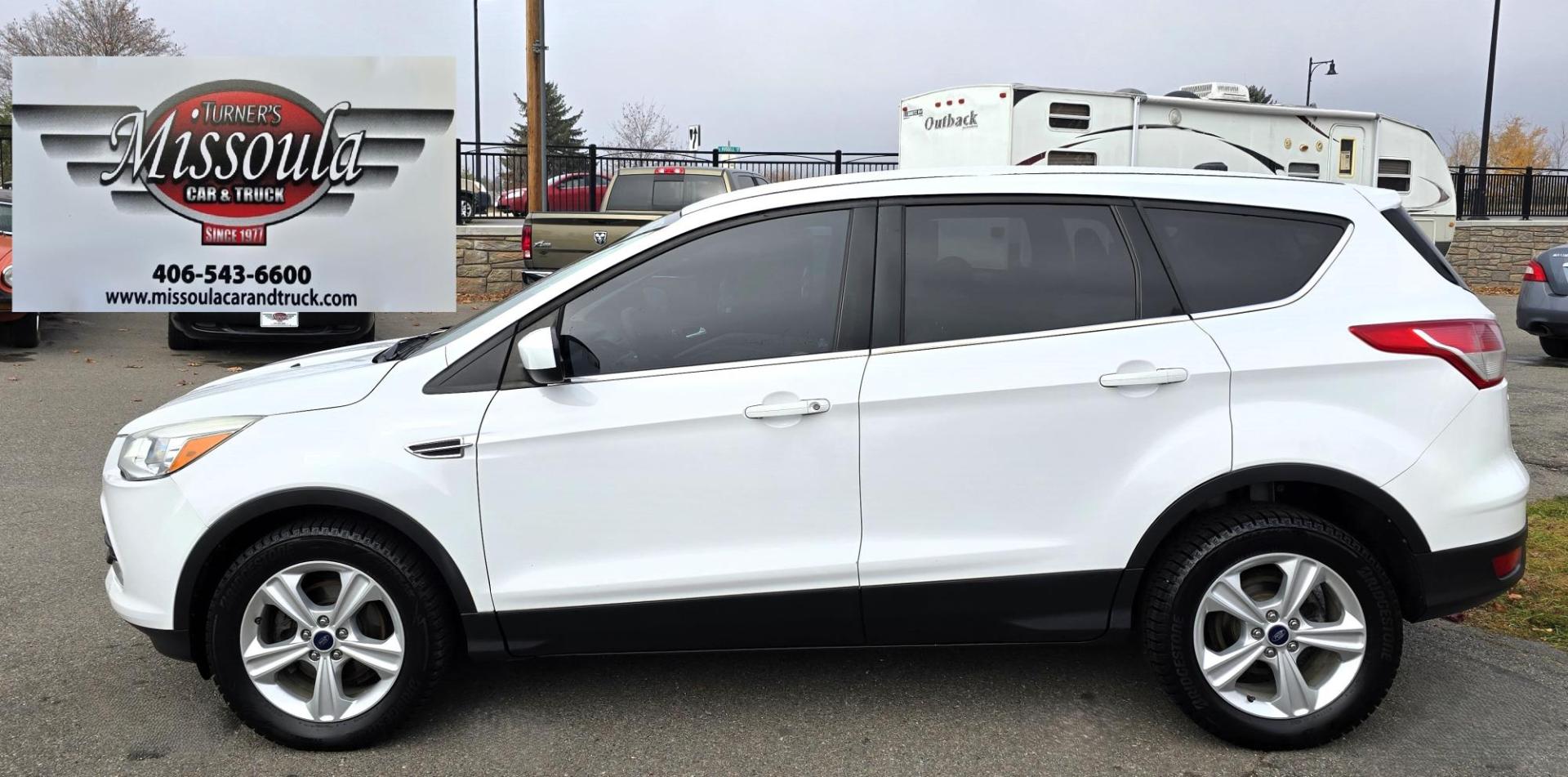 2014 White /Black Ford Escape SE FWD (1FMCU0GXXEU) with an 1.6L L4 DOHC 16V engine, 6-Speed Automatic transmission, located at 450 N Russell, Missoula, MT, 59801, (406) 543-6600, 46.874496, -114.017433 - Great Running Ford Escape EcoBoost. Front Wheel Drive. 1.6L I4 Engine. 6 Speed Automatic. Air. Cruise. Tilt. Power Windows and Locks. AM FM XM CD. Bluetooth Audio and Phone. Nice Bridgestone Tires. - Photo#5