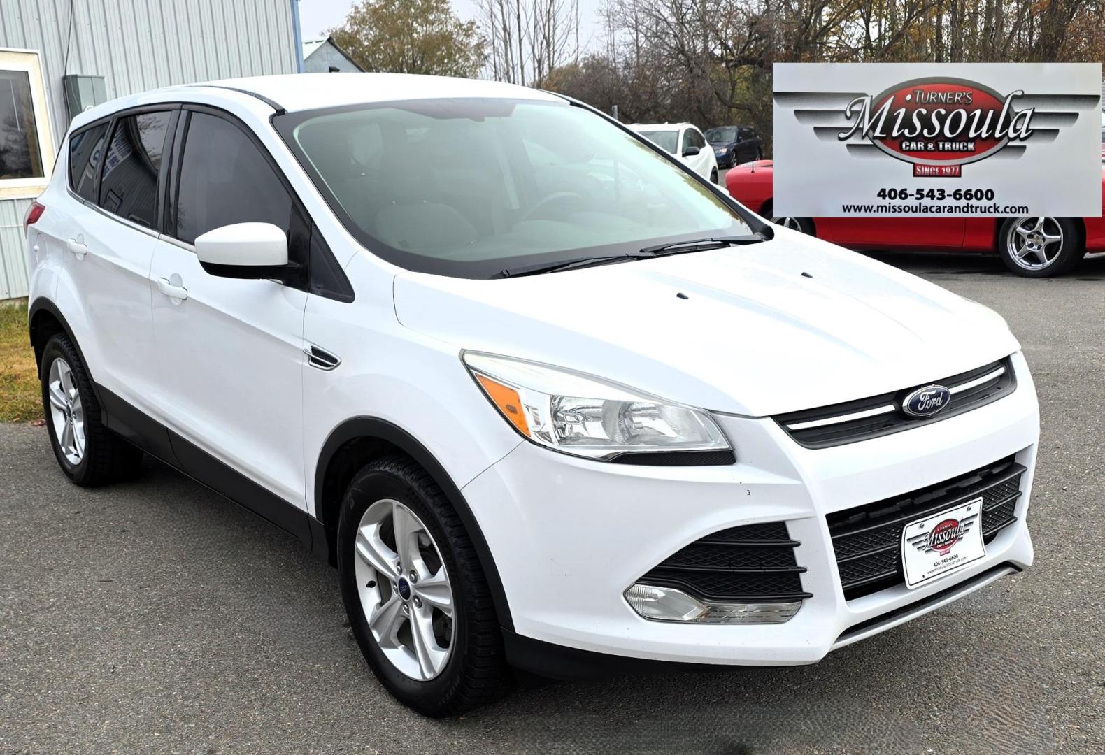 2014 White /Black Ford Escape SE FWD (1FMCU0GXXEU) with an 1.6L L4 DOHC 16V engine, 6-Speed Automatic transmission, located at 450 N Russell, Missoula, MT, 59801, (406) 543-6600, 46.874496, -114.017433 - Great Running Ford Escape EcoBoost. Front Wheel Drive. 1.6L I4 Engine. 6 Speed Automatic. Air. Cruise. Tilt. Power Windows and Locks. AM FM XM CD. Bluetooth Audio and Phone. Nice Bridgestone Tires. - Photo#7