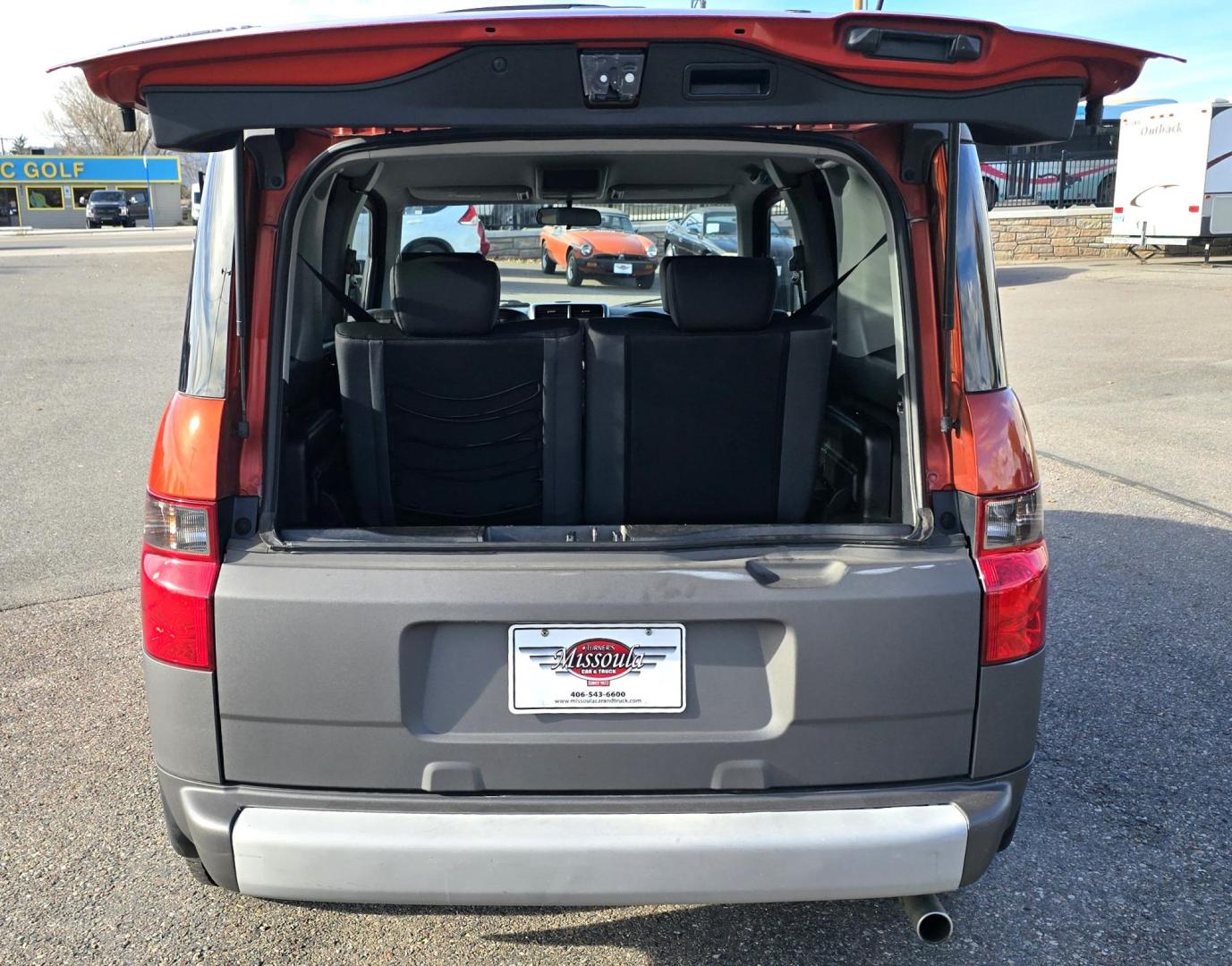 2005 Orange /Black Honda Element EX 4WD 4-spd AT (5J6YH28695L) with an 2.4L L4 DOHC 16V engine, 4-Speed Automatic Overdrive transmission, located at 450 N Russell, Missoula, MT, 59801, (406) 543-6600, 46.874496, -114.017433 - Photo#5