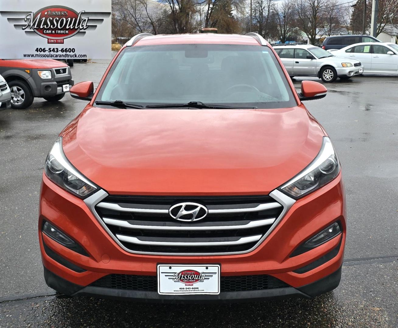 2017 Orange /Black Hyundai Tucson SE w/Preferred Package AWD (KM8J3CA44HU) with an 2.0L L4 DOHC 16V engine, 6A transmission, located at 450 N Russell, Missoula, MT, 59801, (406) 543-6600, 46.874496, -114.017433 - Beautiful Clean AWD SUV. 2.0L I4 Engine. 6 Speed Automatic Transmission. Heated Power Seats. Navigation. Infinity Sound System. AM FM SAT. Bluetooth Audio and Phone. Blindspot Detection. Backup Camera. - Photo#2